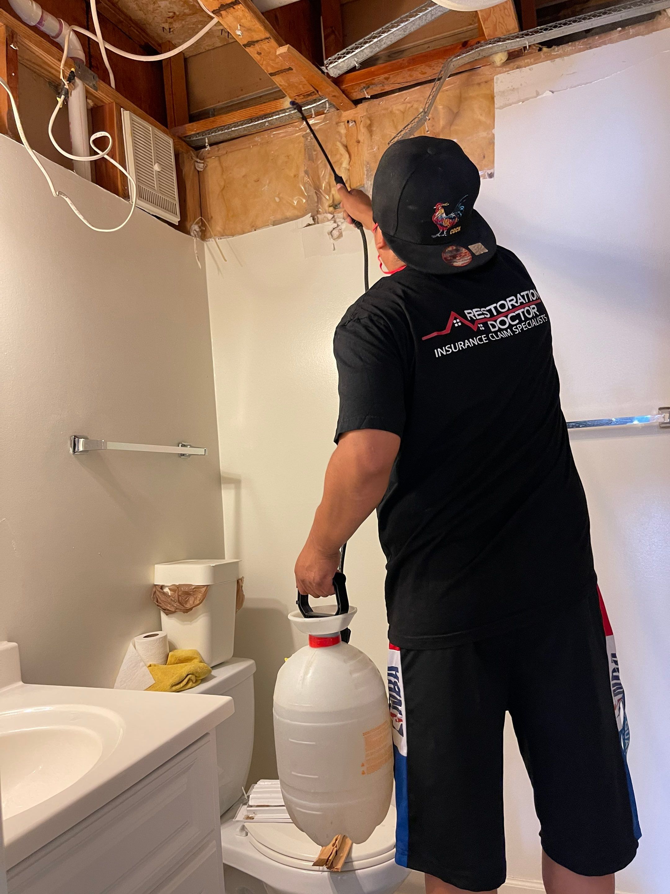 Structural drying underway with dehumidifiers and air movers managing moisture extraction from damaged ceiling area.