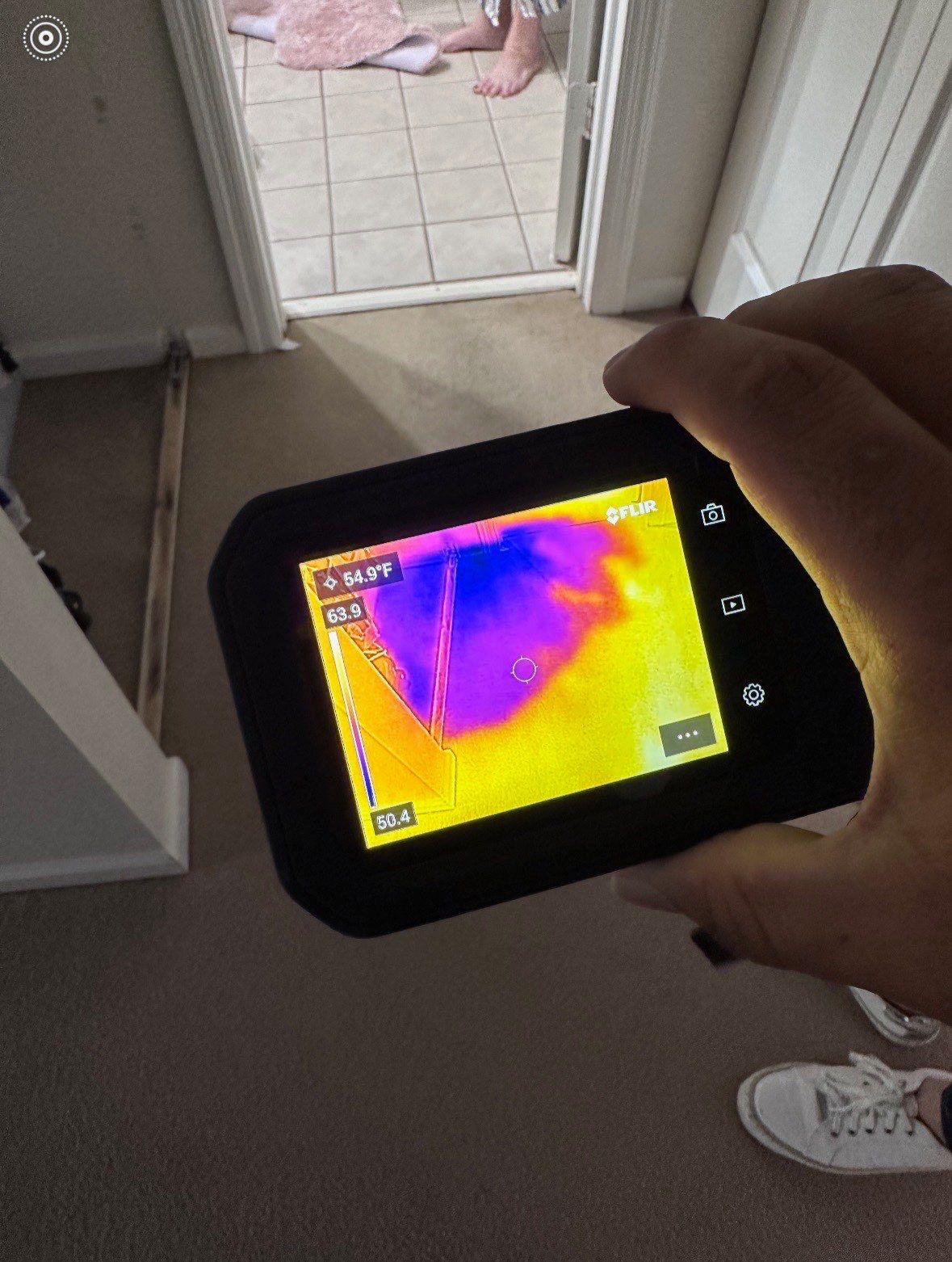 Dehumidification equipment monitoring structural drying progress before ceiling repair work begins.
