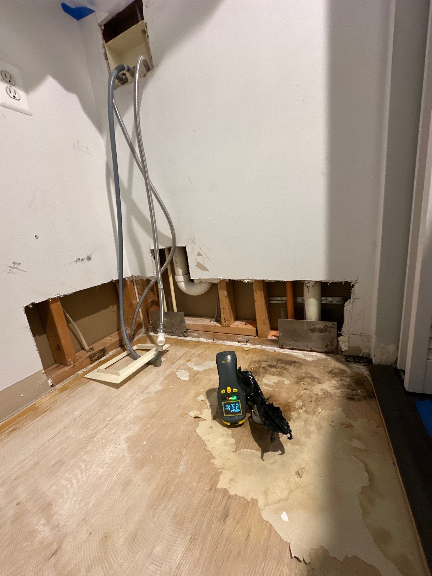 Dehumidification and air movement equipment positioned inside containment for structural drying phase.