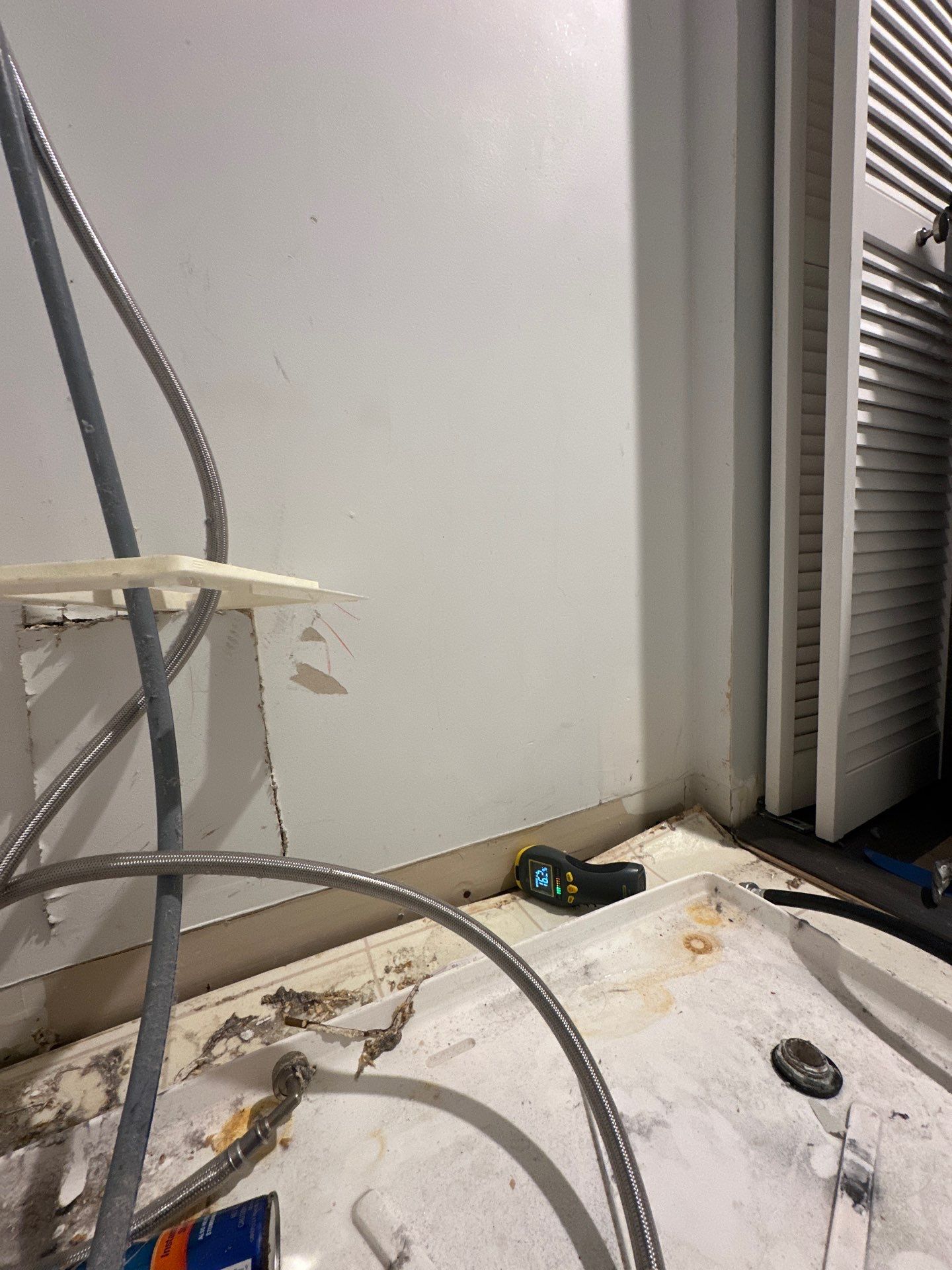 Moisture readings taken at framing and subfloor during mid-sequence inspection of Reston water damage job.