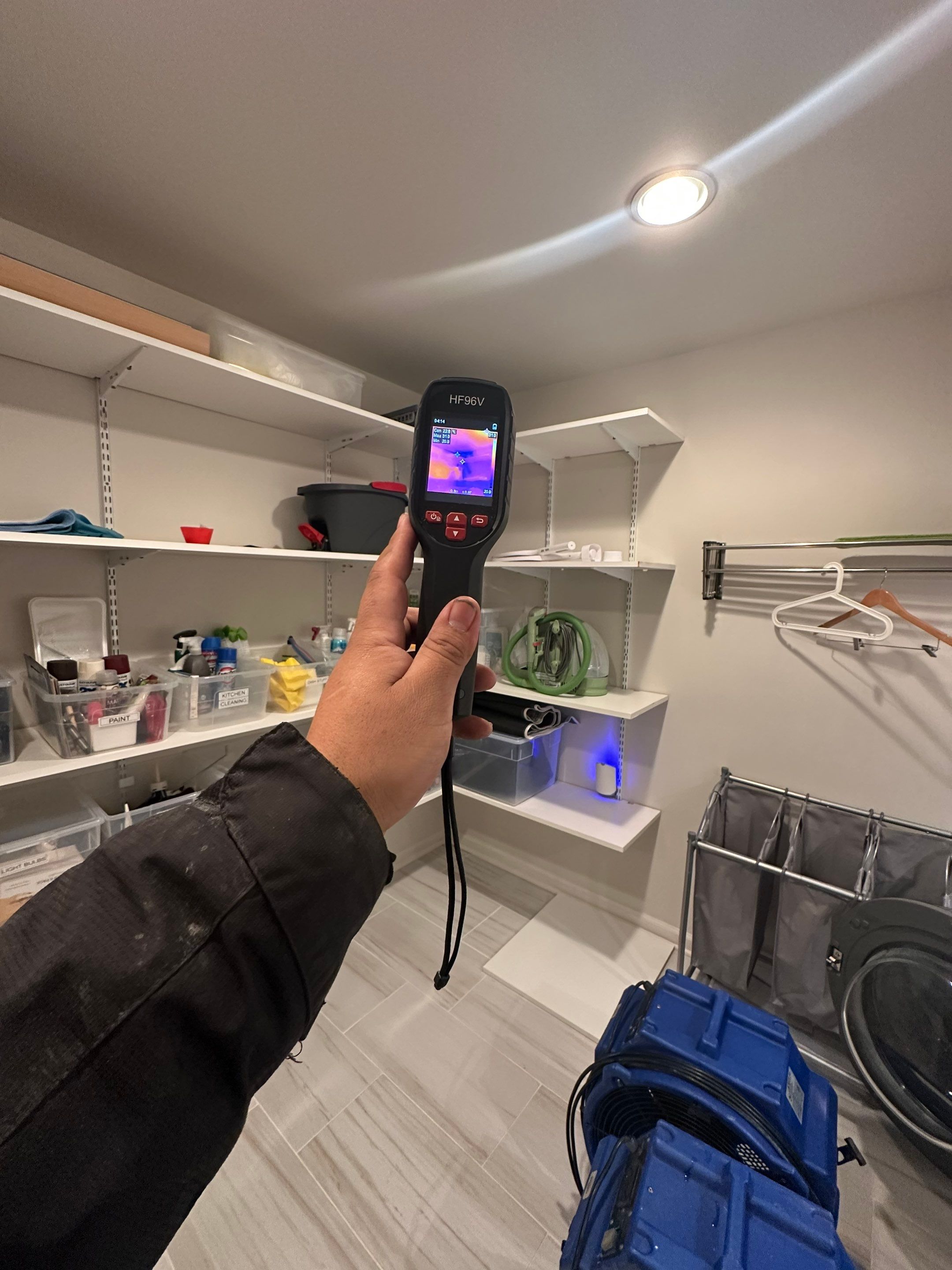 Thermal imaging identifying moisture concentration areas to guide targeted drying strategy.