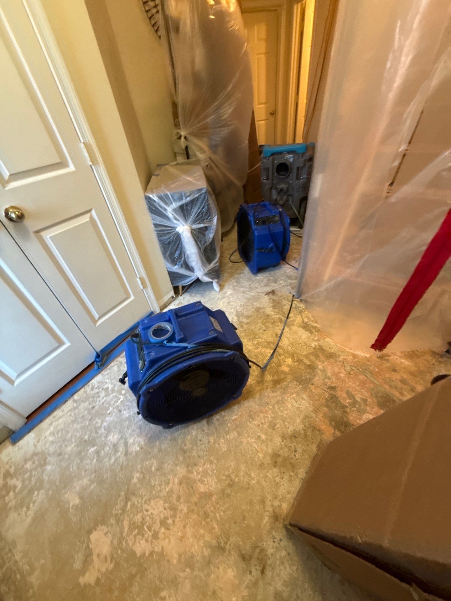 New baseboard installation beginning as final phase of structural restoration.