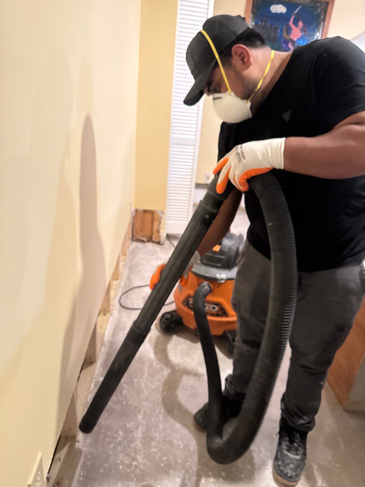 Flooring removal and disposal as part of mold remediation in Great Falls residence.