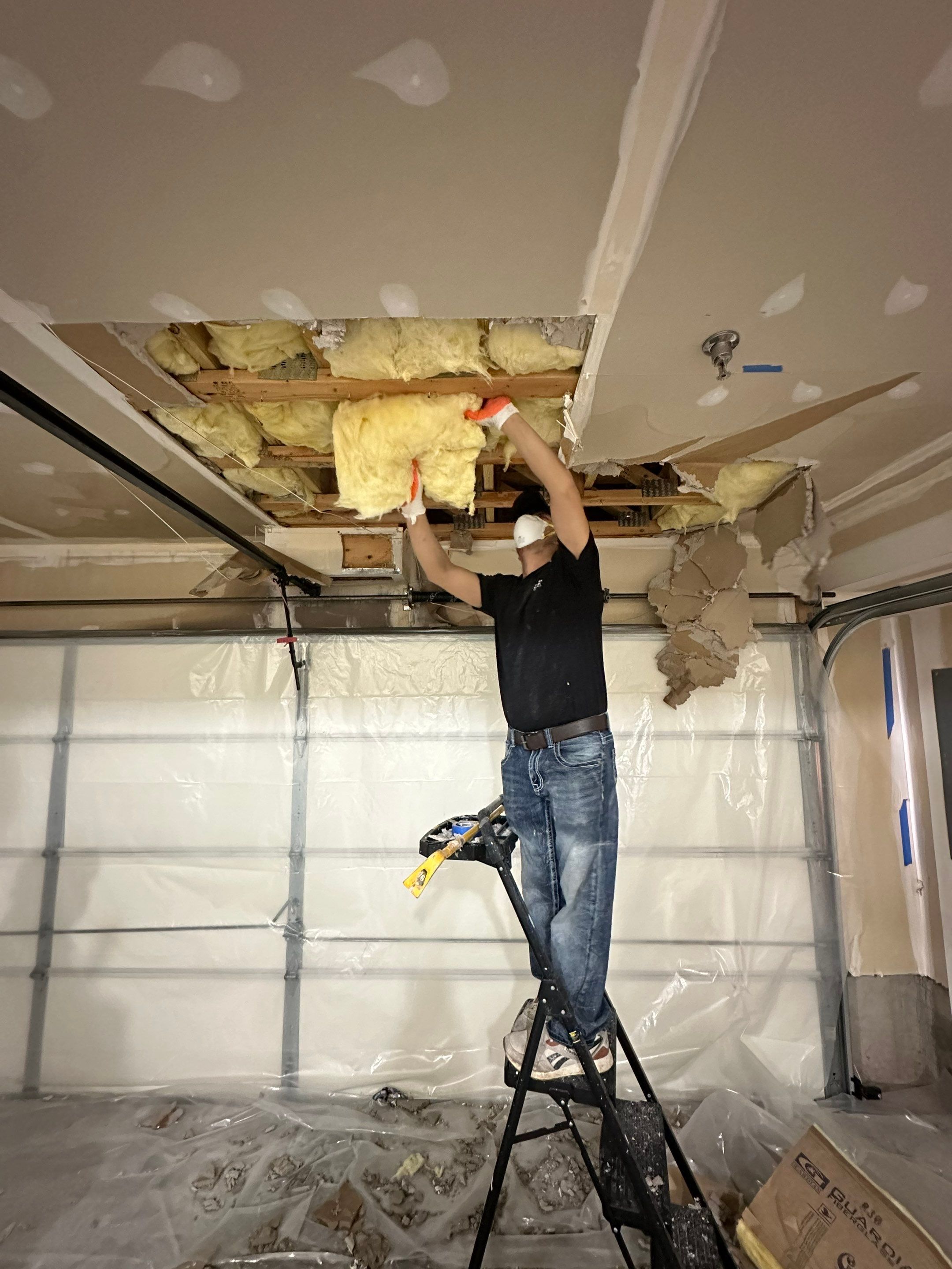 Containment and drying setup in place as part of Fairfax water damage restoration process for ceiling repair.