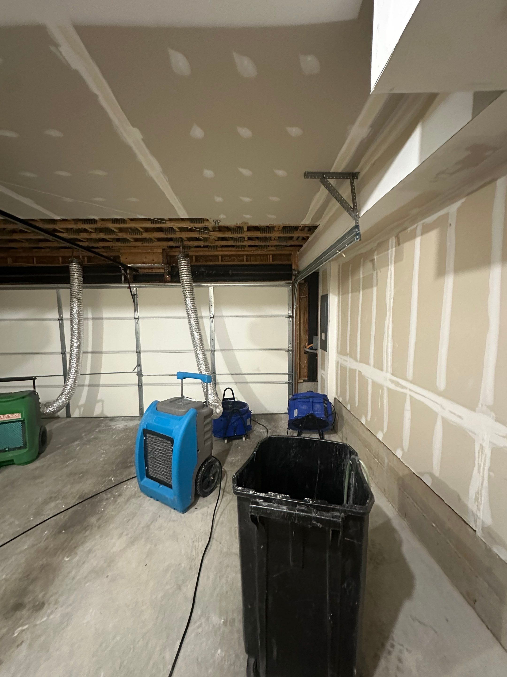 Water-damaged drywall ceiling in Fairfax home showing discoloration and structural compromise before restoration work begins.