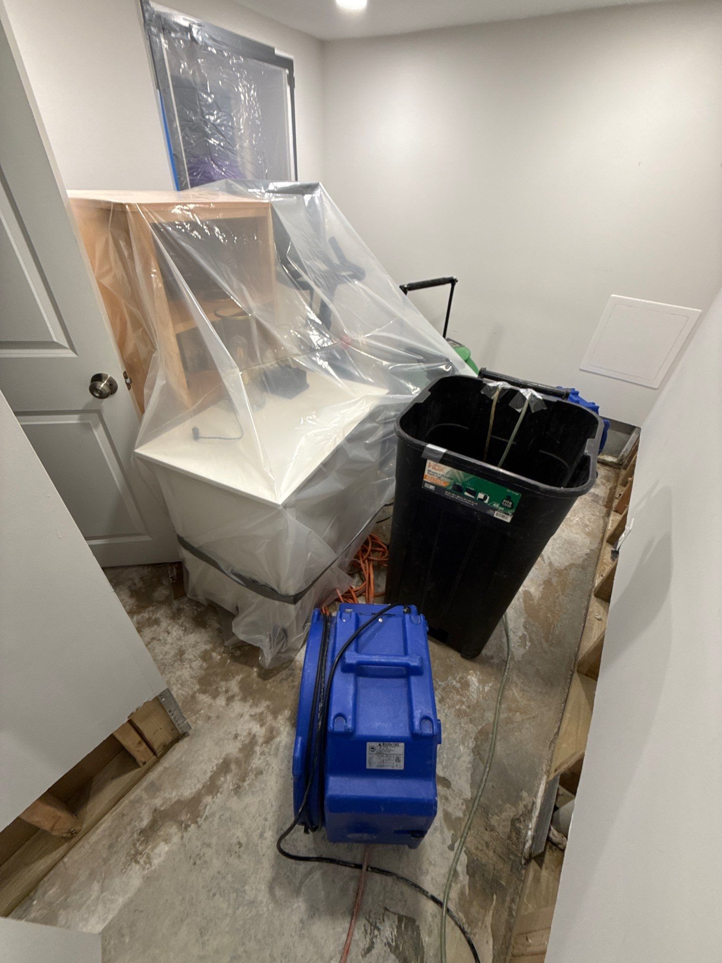 Structural materials exposed for thorough drying and moisture assessment in restoration work.