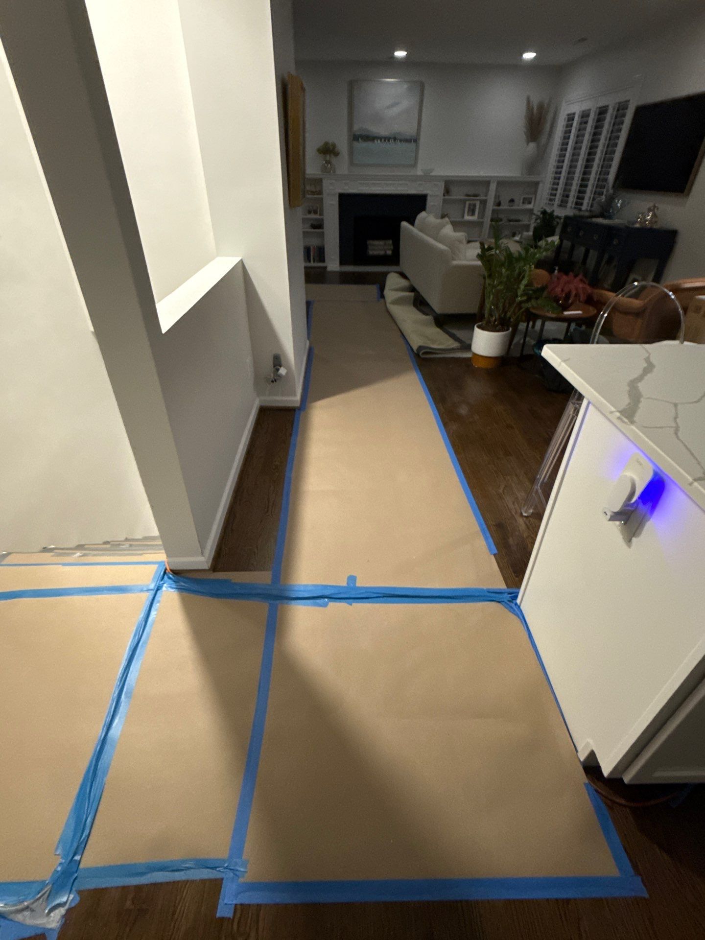 Equipment repositioning during active drying phase of Alexandria water damage restoration.
