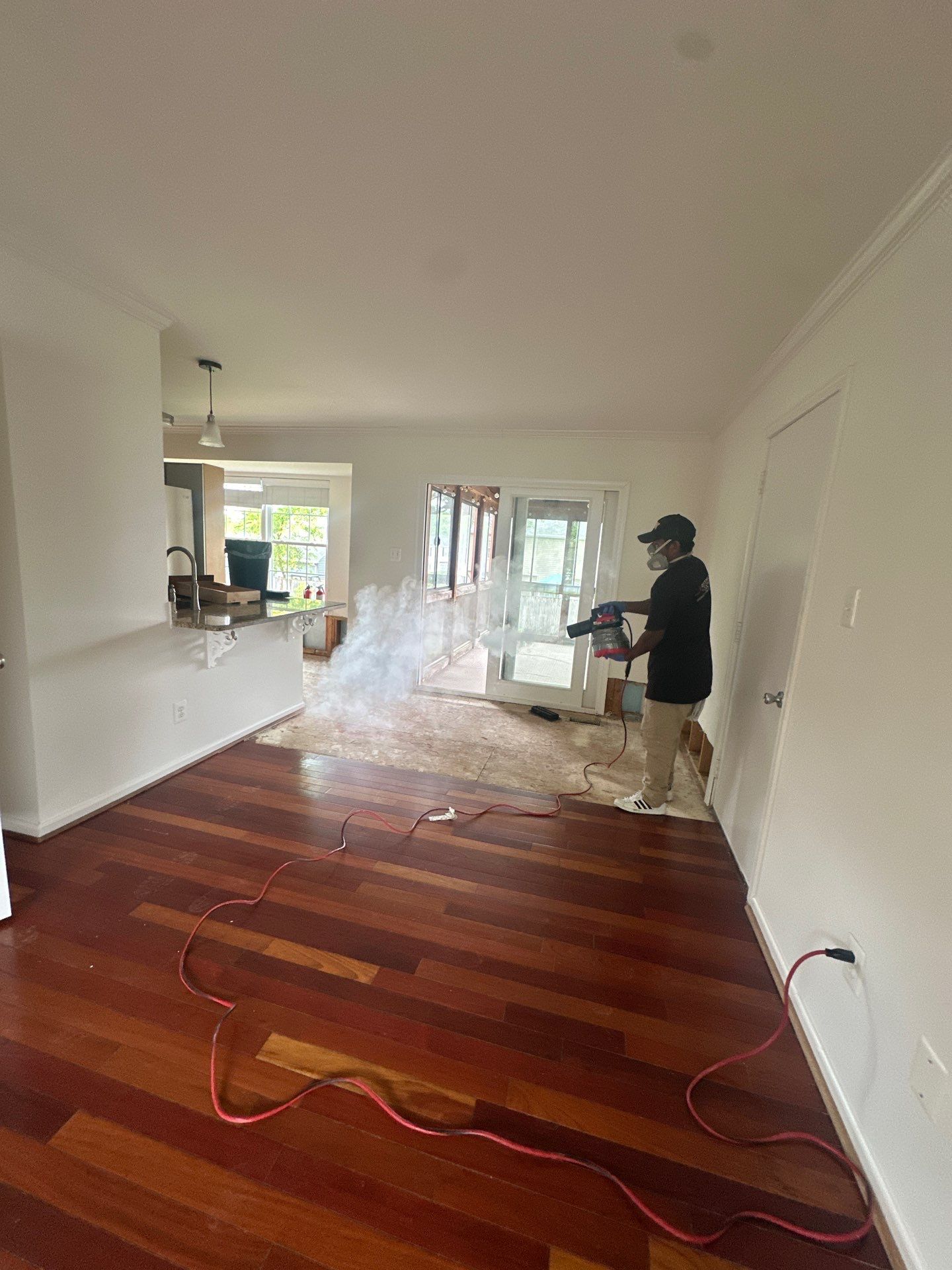 Final stage of water damage restoration in Herndon showing cleared flooring and completed structural drying.