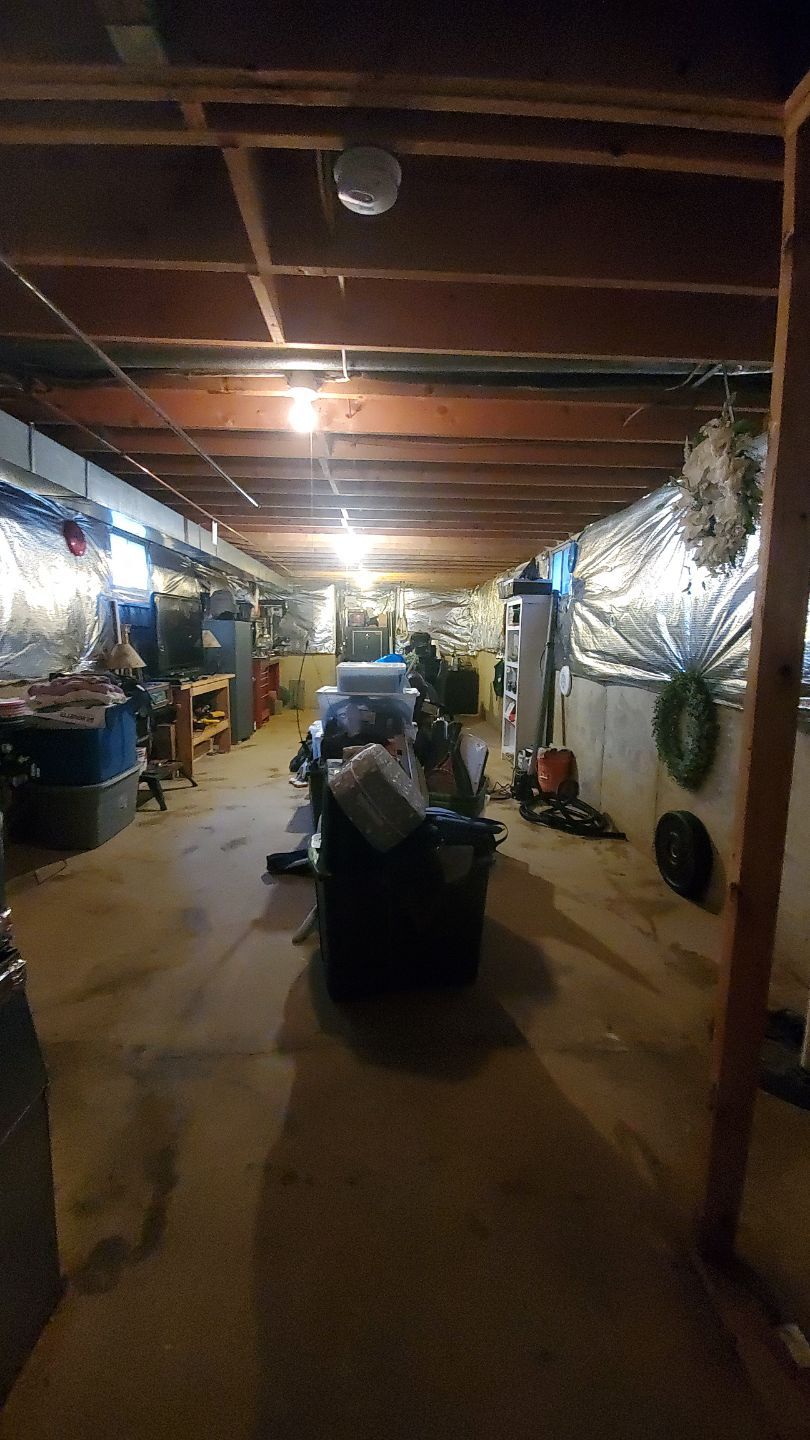 Water damage restoration in Leesburg: dehumidifier and air movers deployed for structural drying after water intrusion.