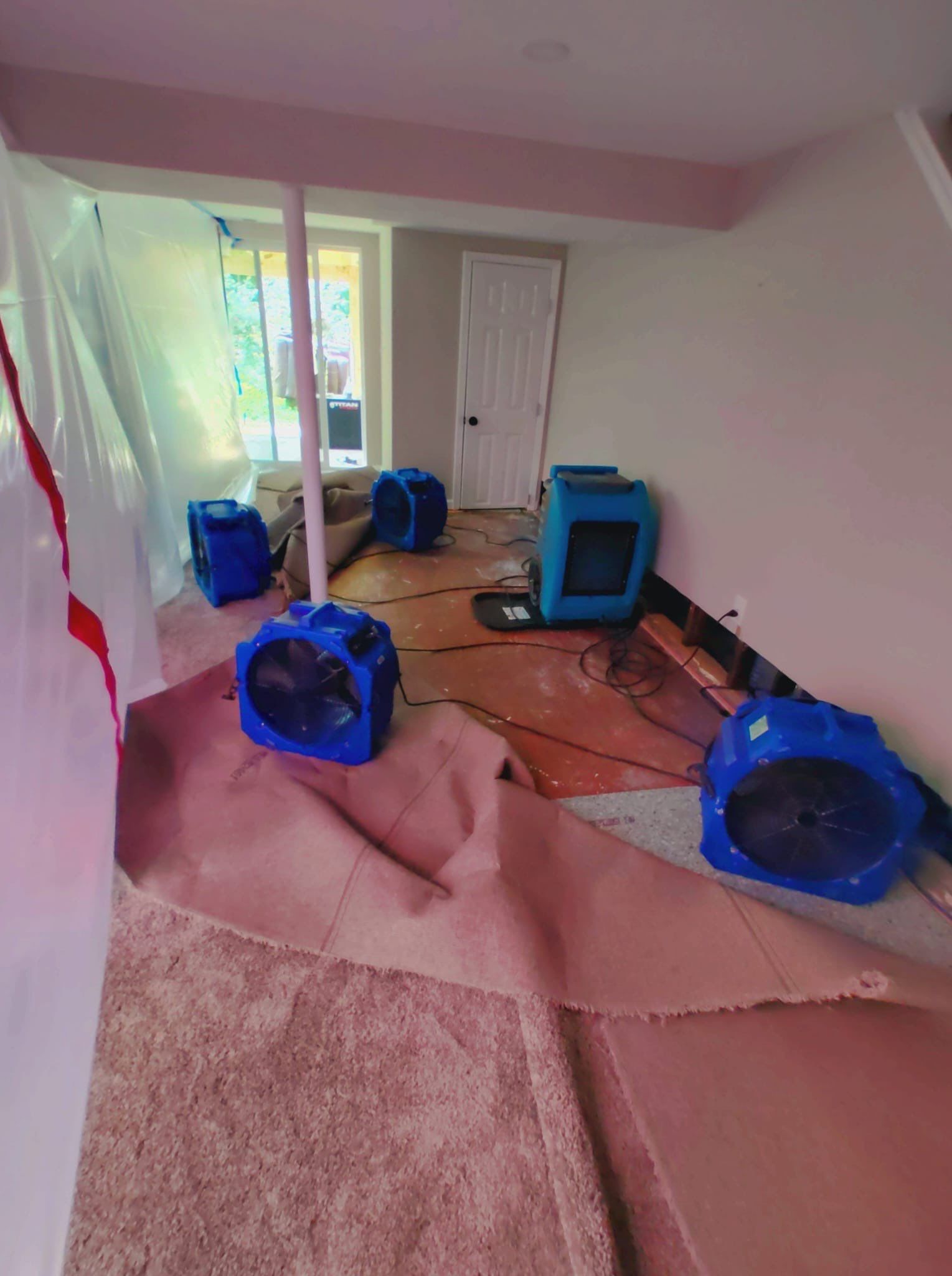 Mid-stage drying with containment barrier maintaining controlled restoration environment.