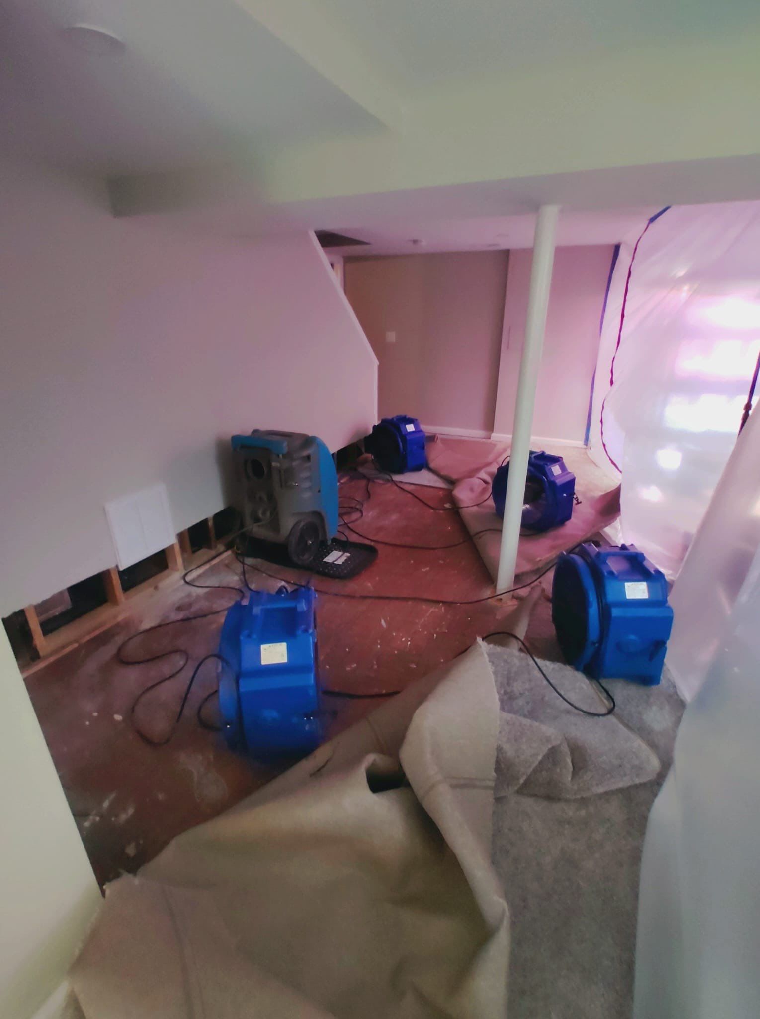 Final-stage water damage restoration showing equipment removal and structural drying completion.