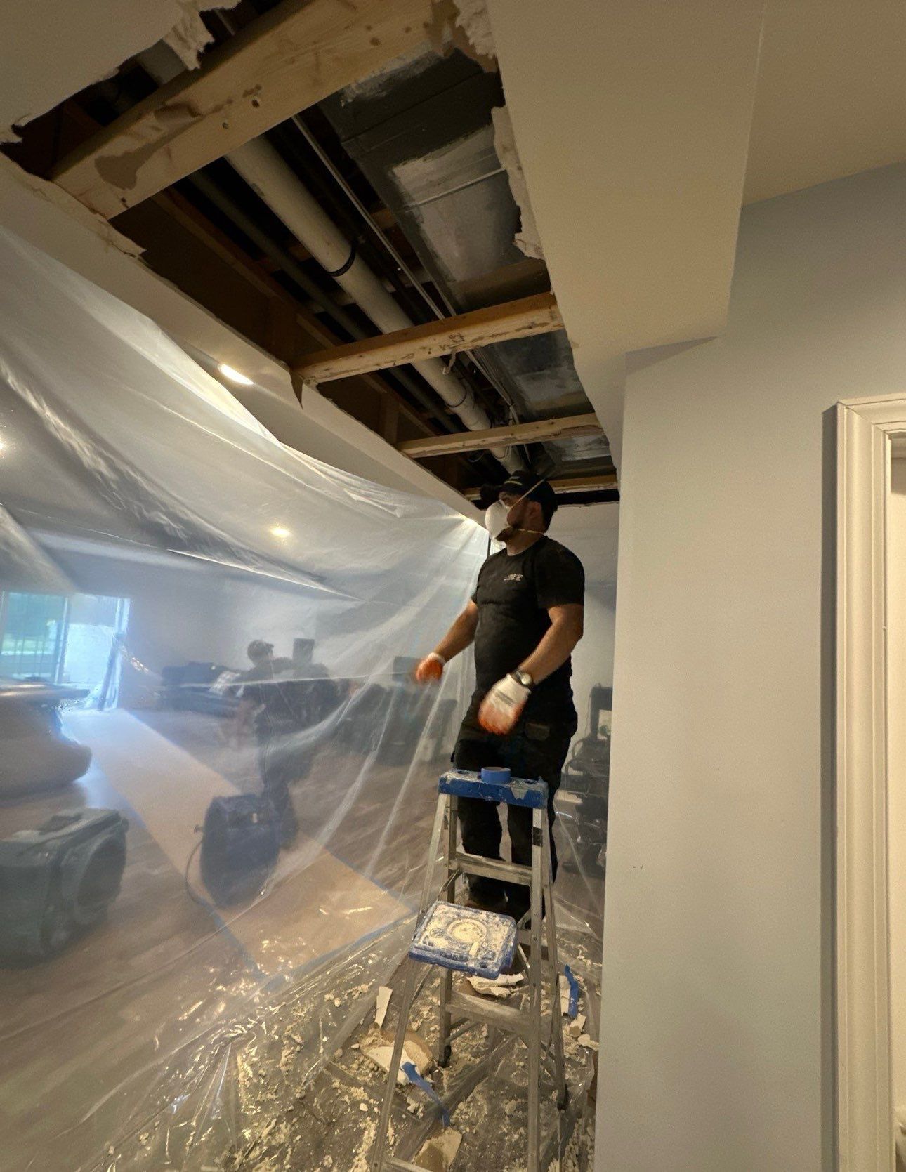 Dehumidification and air movement equipment positioned for structural drying phase of water restoration in Alexandria.