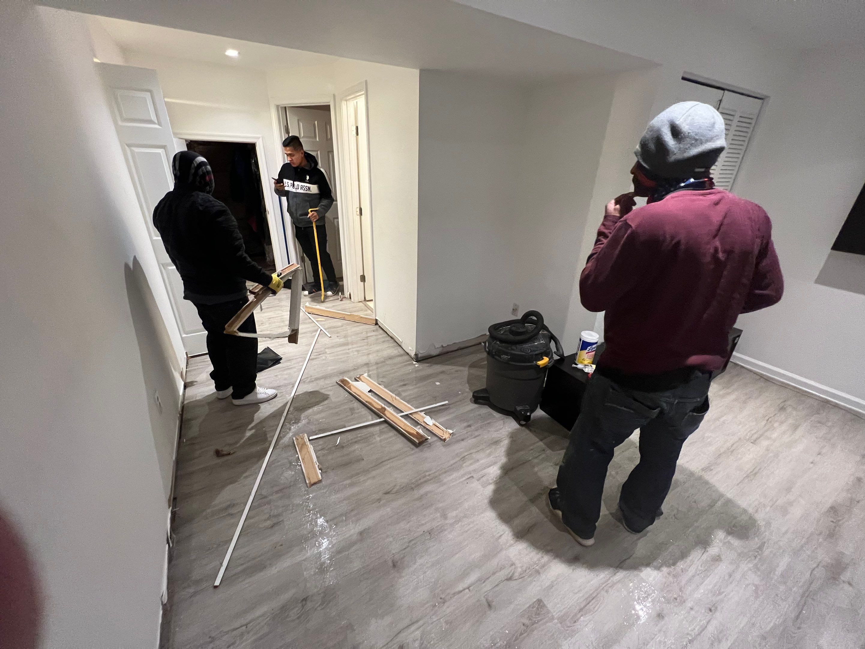 Dehumidification equipment positioned during mid-stage drying phase, moisture removal in progress across structural materials.