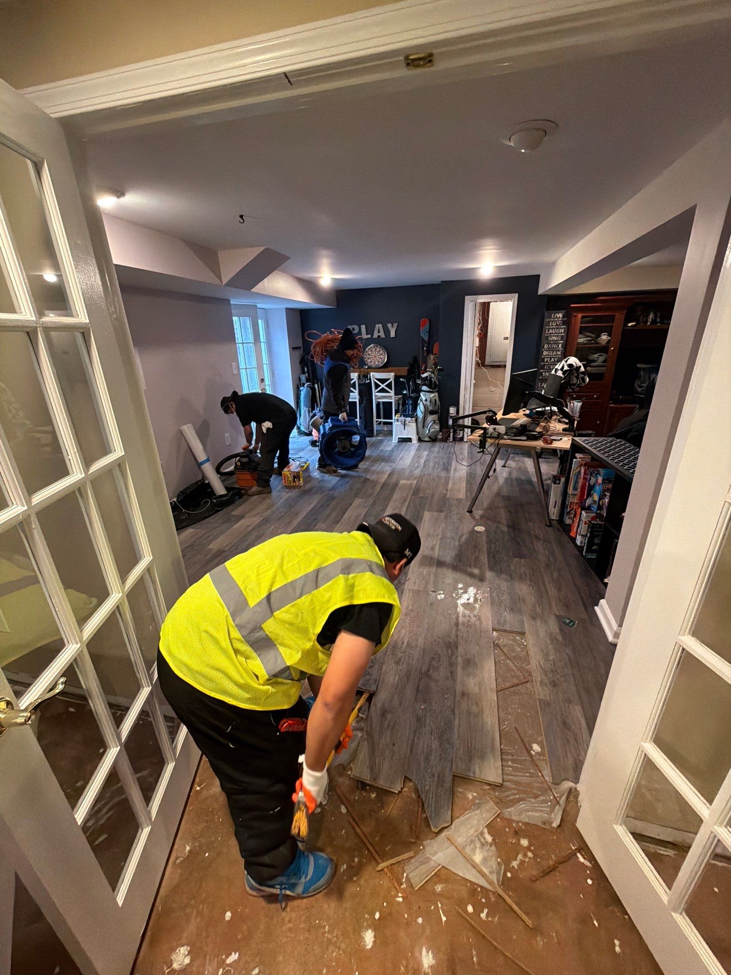 Wet drywall and structural materials exposed after water removal in Vienna home.