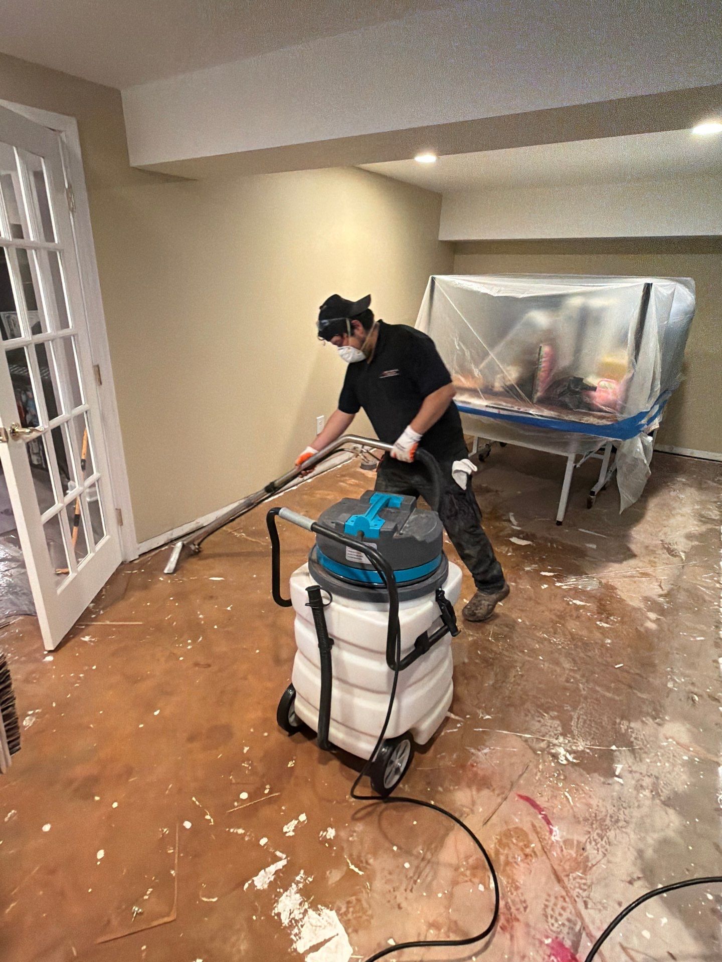 Drying equipment operating to remove residual moisture from Vienna basement structure.
