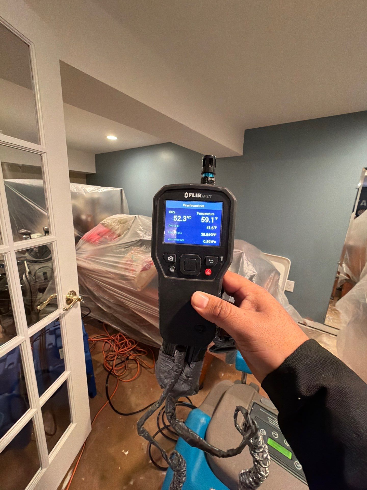 Dehumidifiers and air movers positioned for structural drying phase of Vienna restoration.