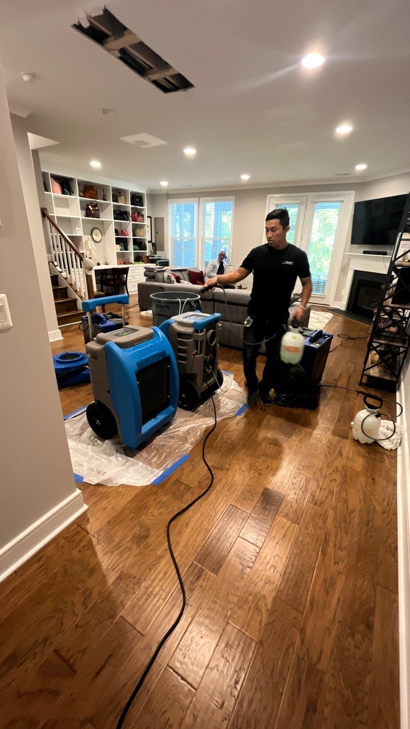 Dehumidification and air movement equipment positioned during structural drying phase of water damage restoration.
