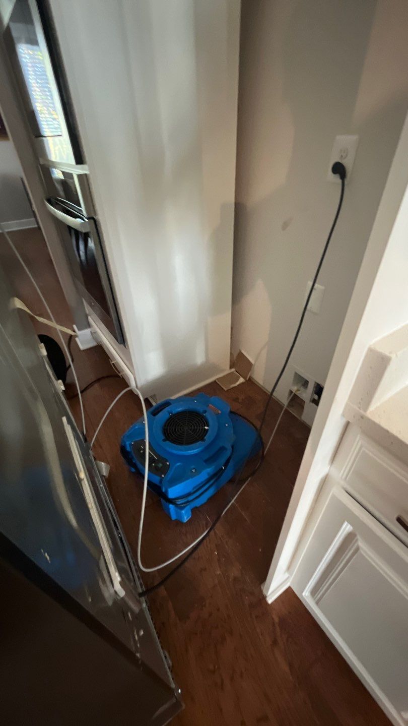Mid-stage drying monitoring with moisture detection equipment during water damage restoration process.