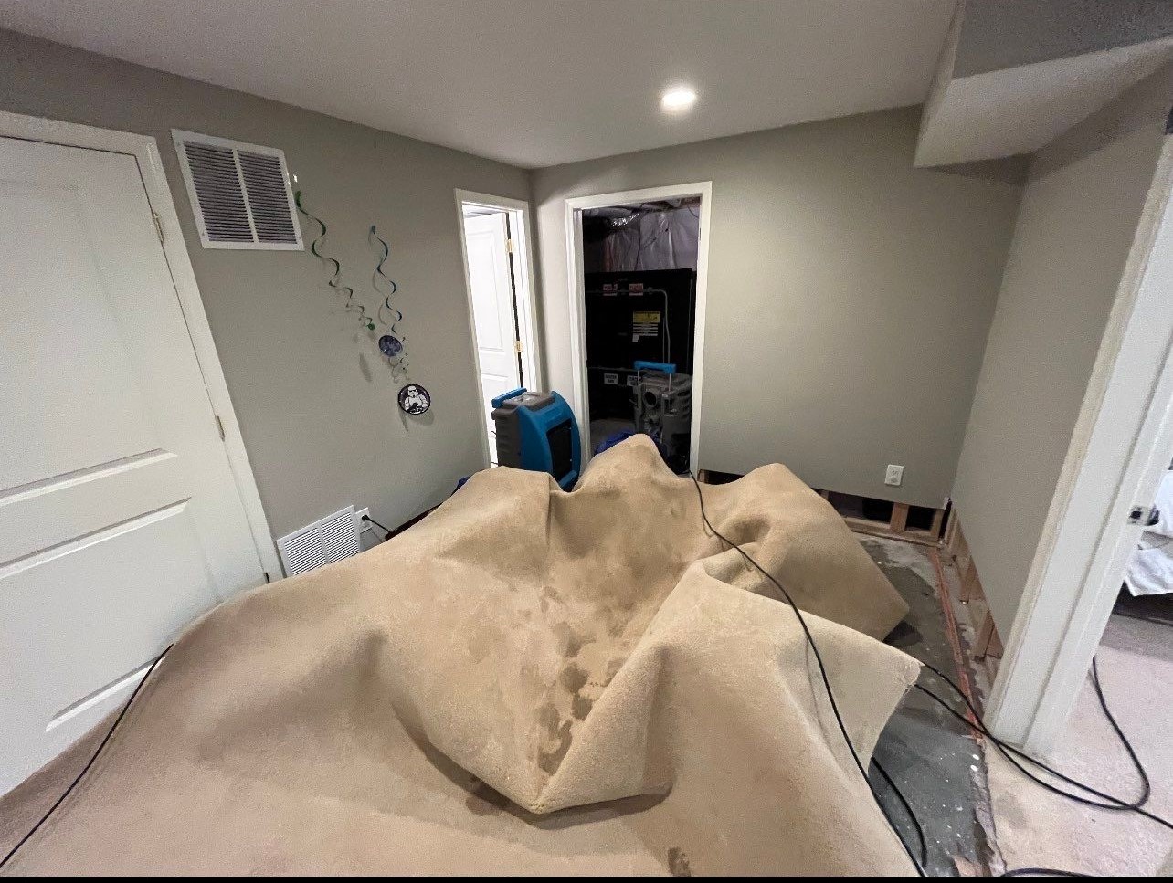 Flooring remediation complete with equipment removal and final drying verification.
