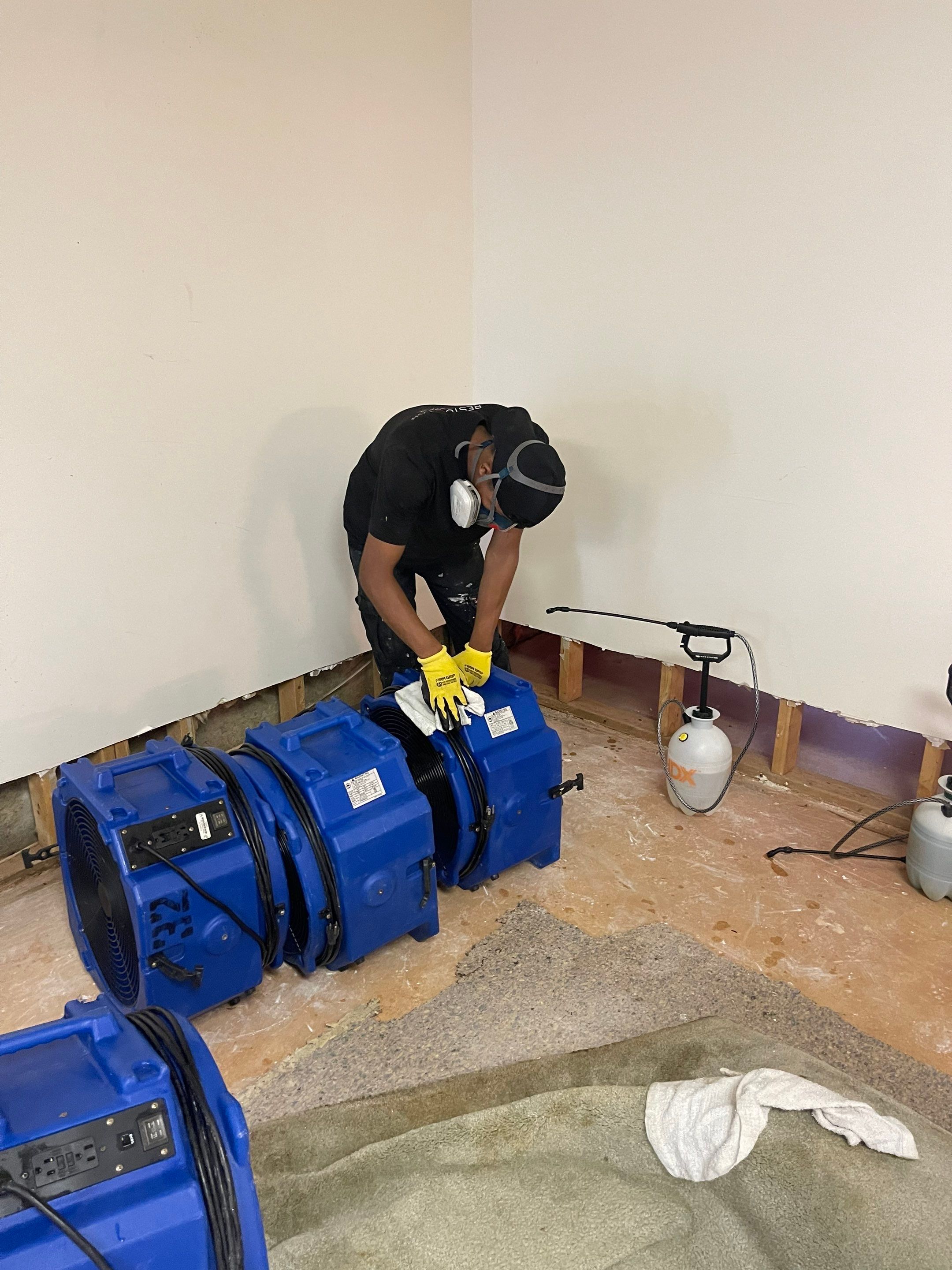 Dehumidification equipment positioned for structural drying phase of restoration project.