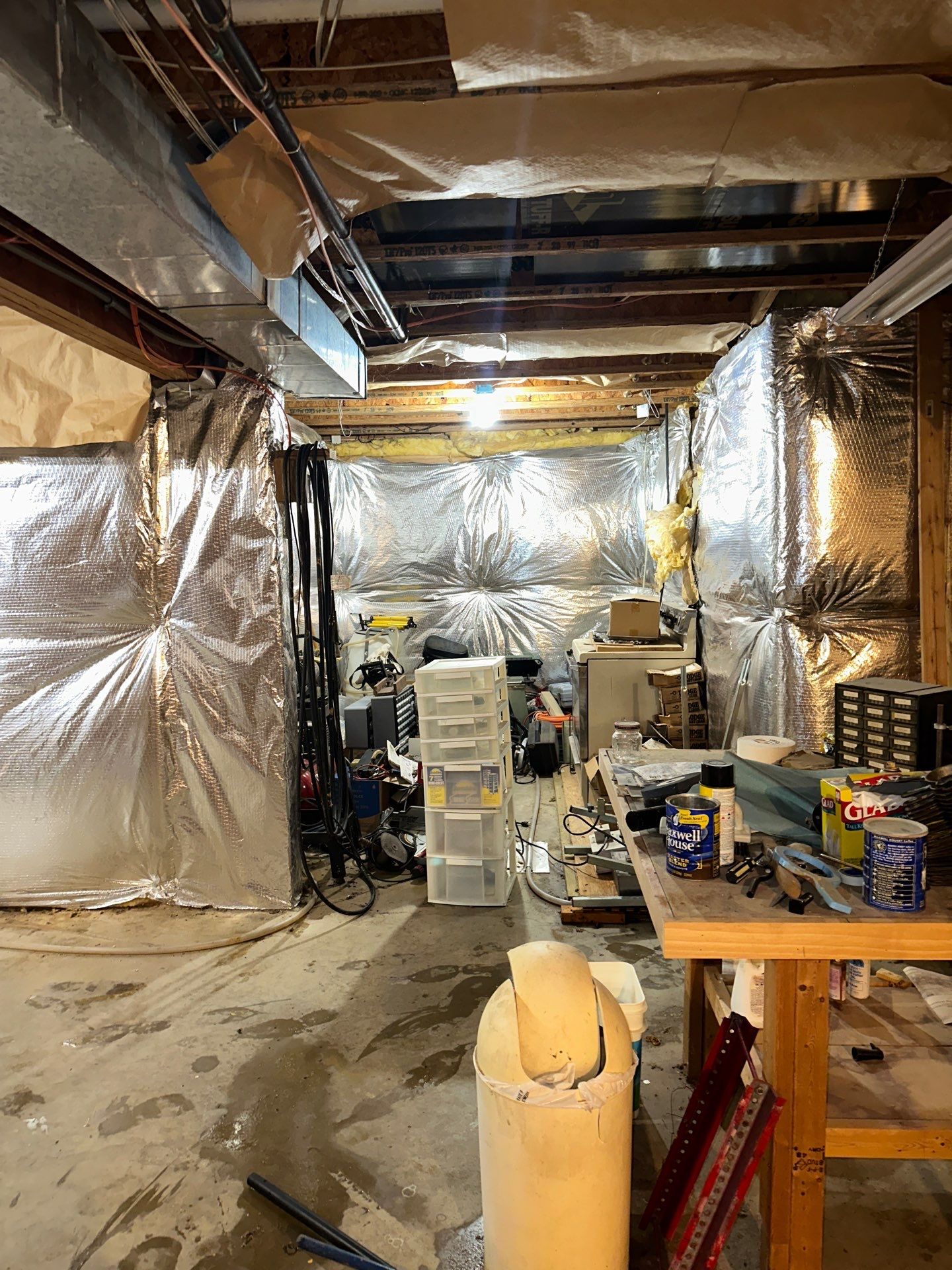 Drying equipment monitoring moisture levels in framing and subfloor after water extraction.