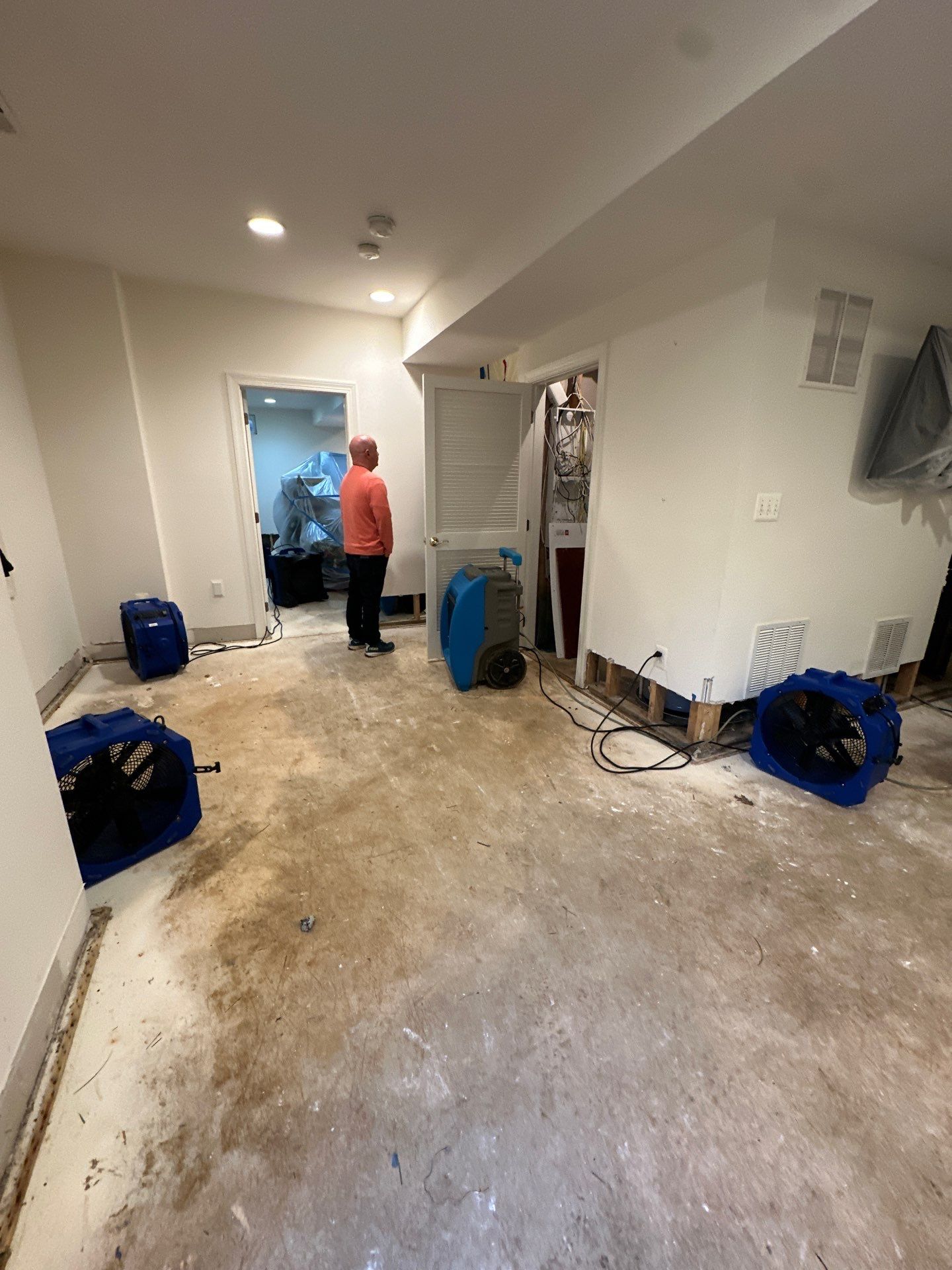 Thermal imaging camera detecting moisture distribution across wall cavity during Fairfax water damage assessment.