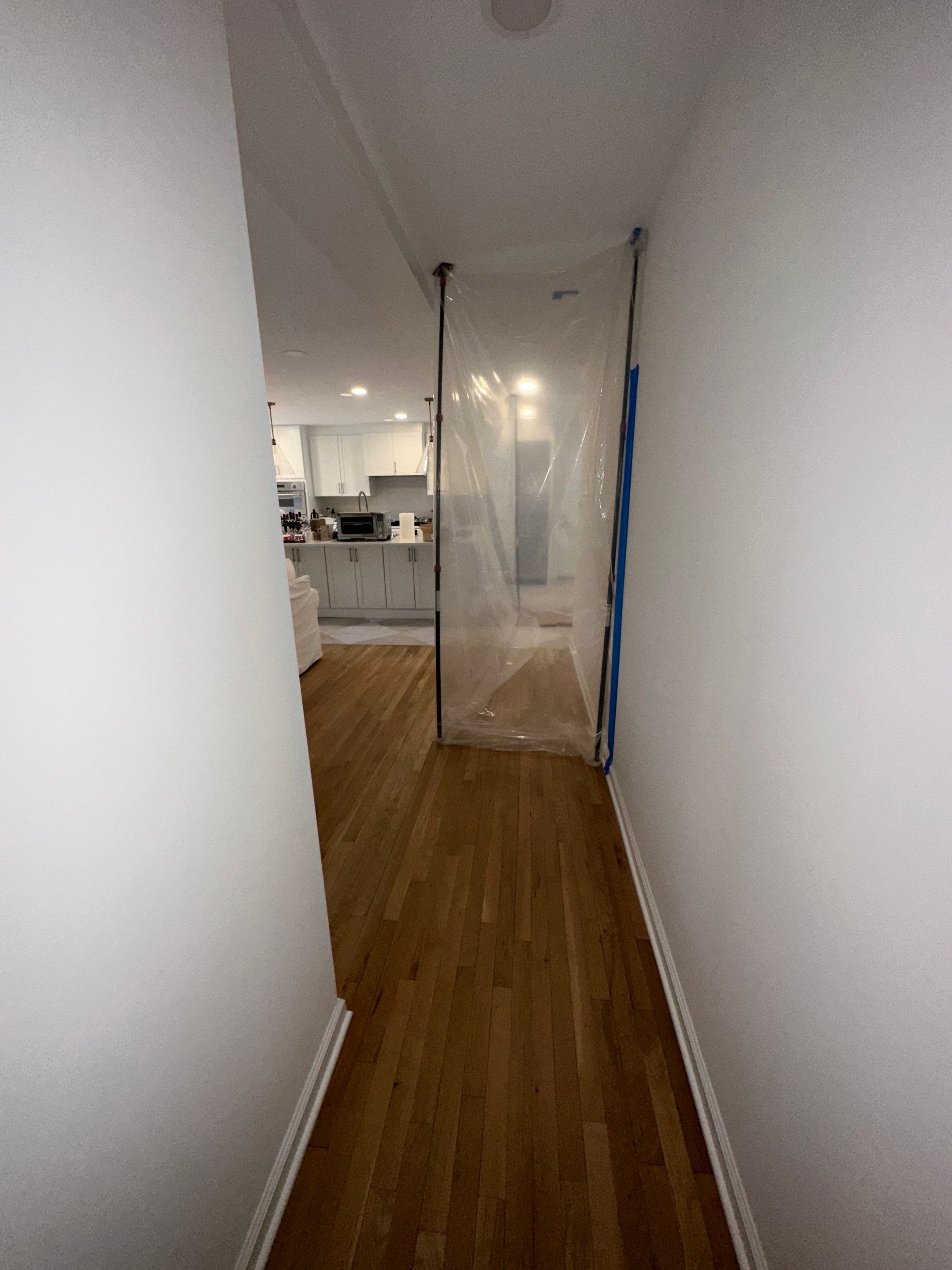 Containment barrier erected around water-damaged wall section during Vienna restoration work.