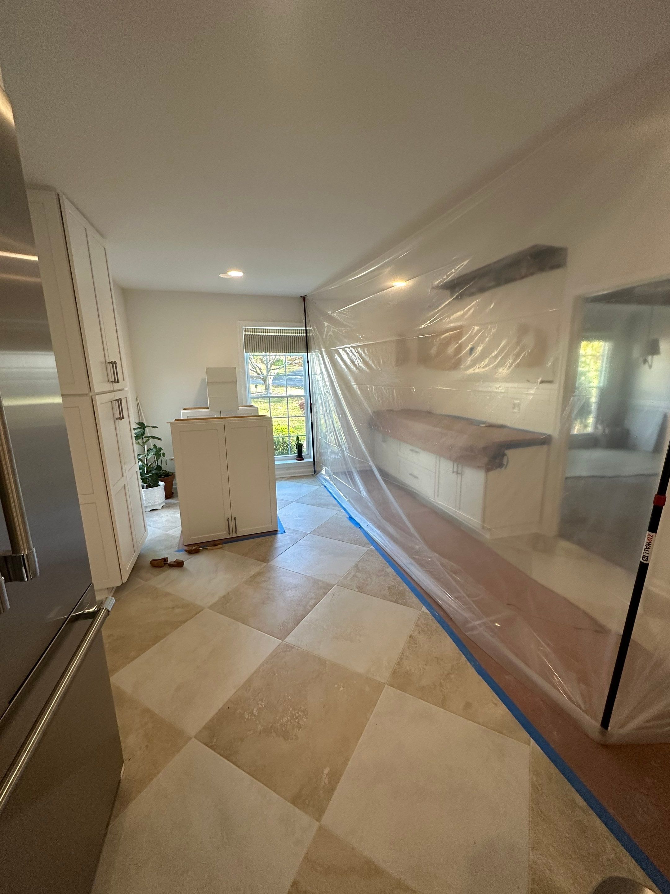 Structural drying equipment positioned within containment during water damage mitigation.