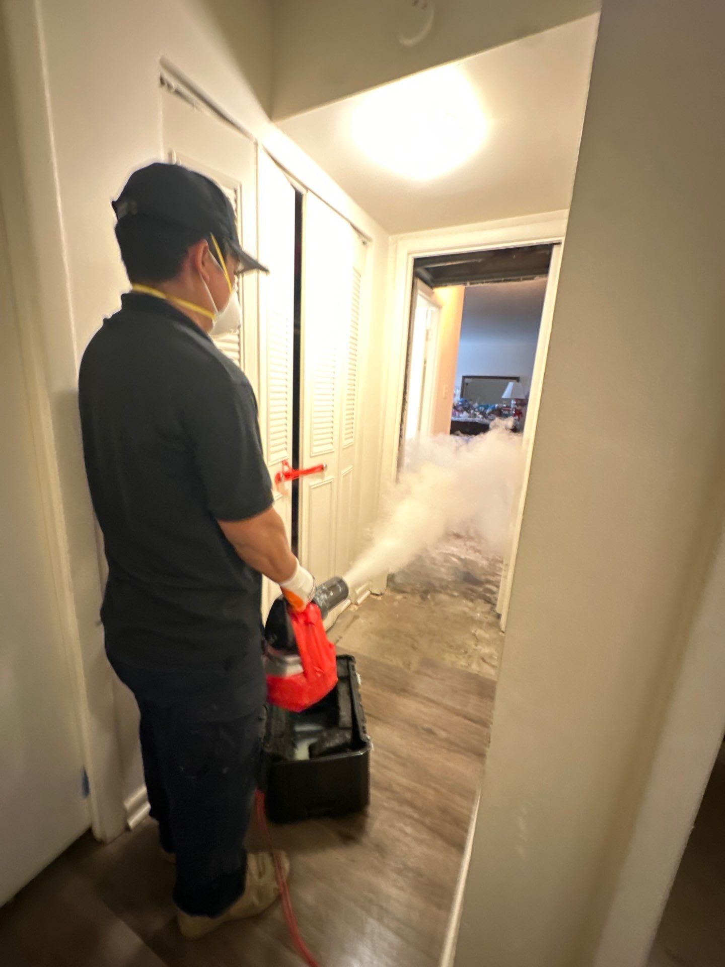 Drying equipment positioned to remove residual moisture from flooring substrate.