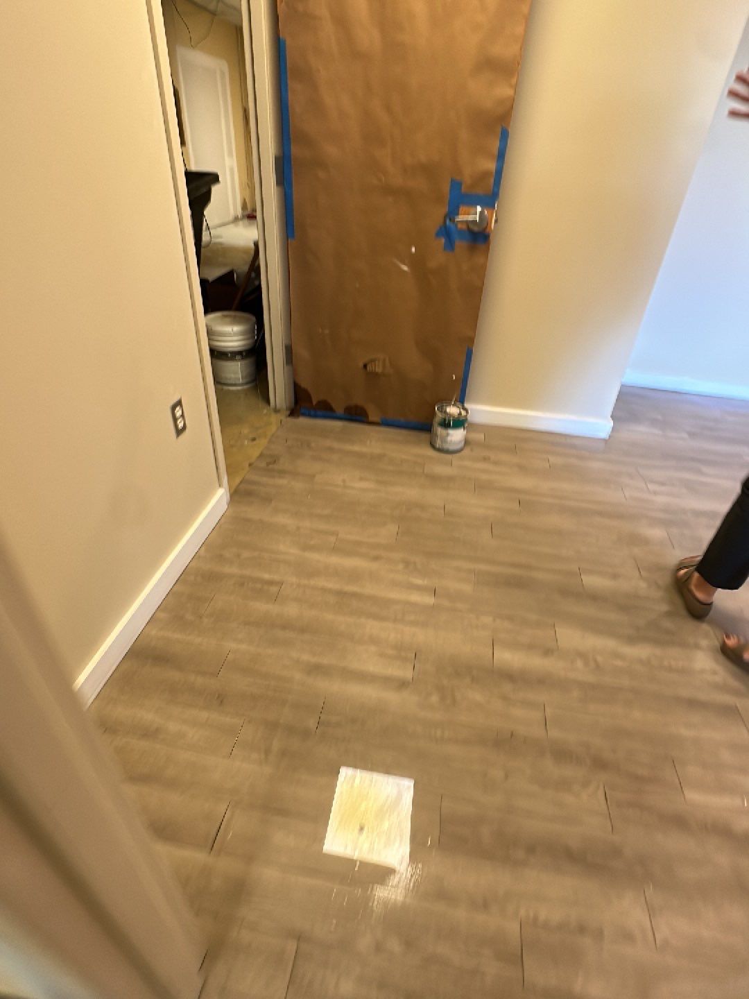 Standing water extraction underway in Reston water damage restoration, wet flooring visible.