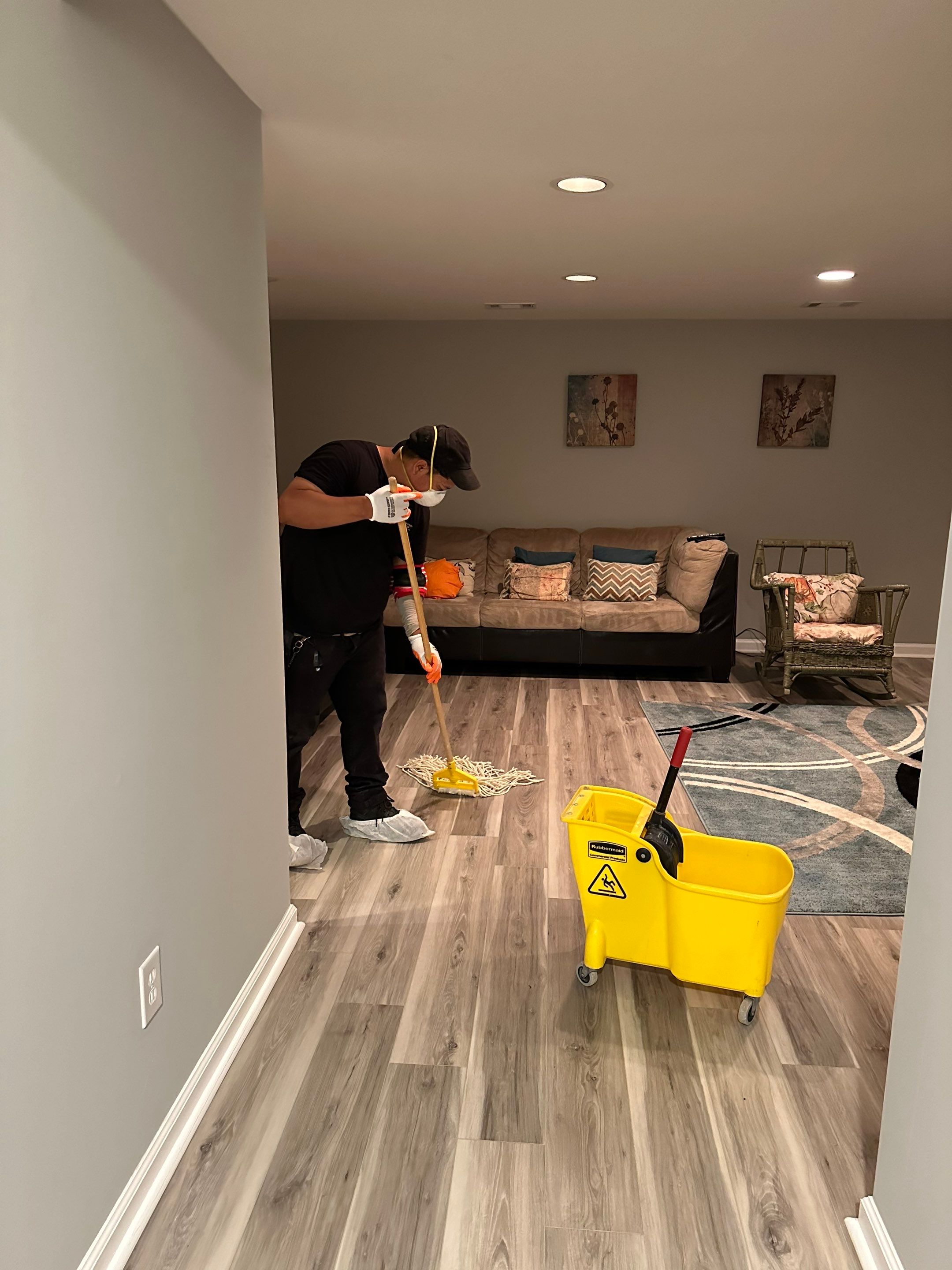 Standing water extraction underway in Vienna water damage restoration, wet flooring visible.
