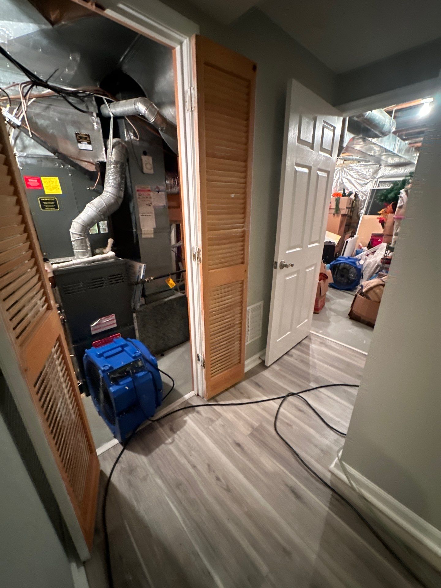 Mid-stage drying showing reduced moisture levels and continued equipment operation.