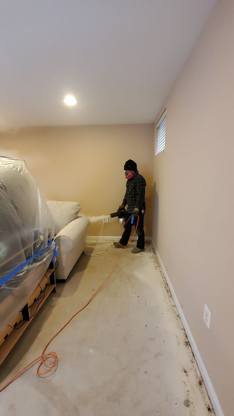 Dehumidifier and drying equipment positioned in Leesburg home during water damage restoration.