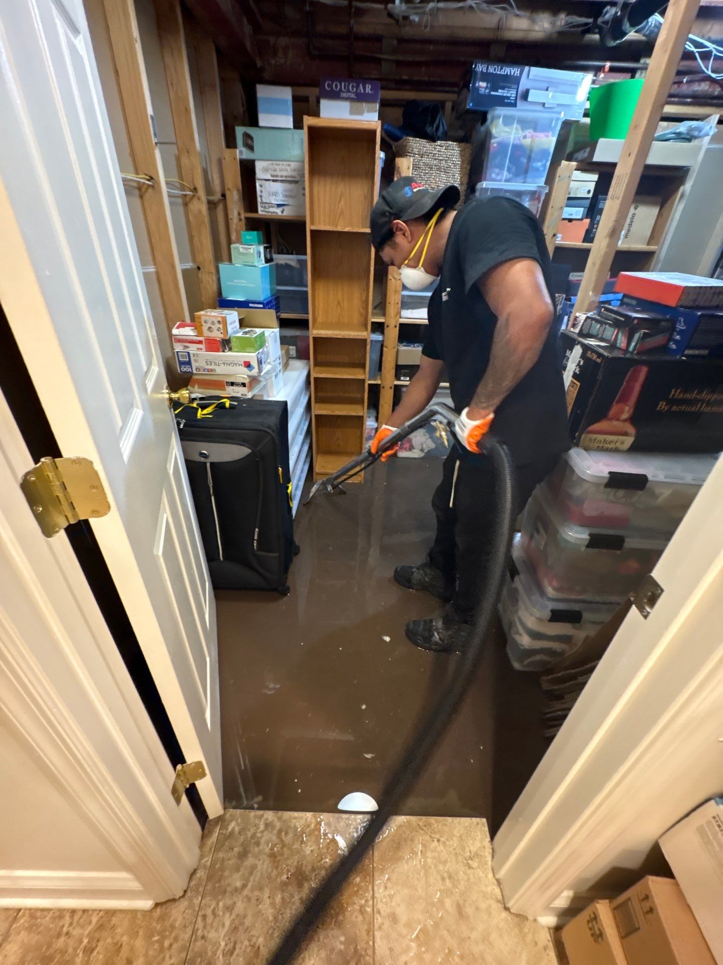 Structural drying phase with dehumidifiers and air movers positioned to manage moisture in affected areas.