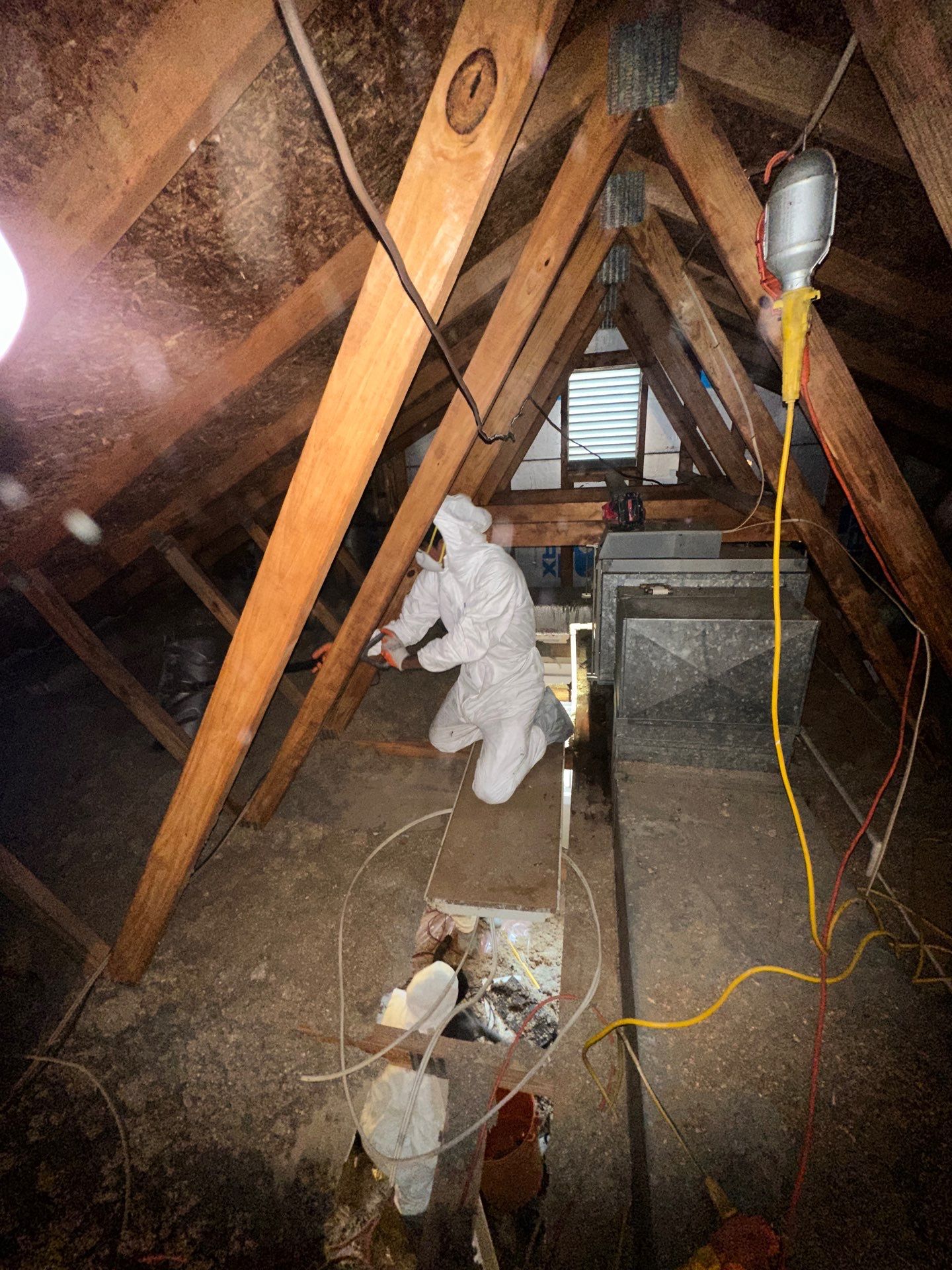 Dehumidification equipment positioned to dry framing and subflooring after water removal.