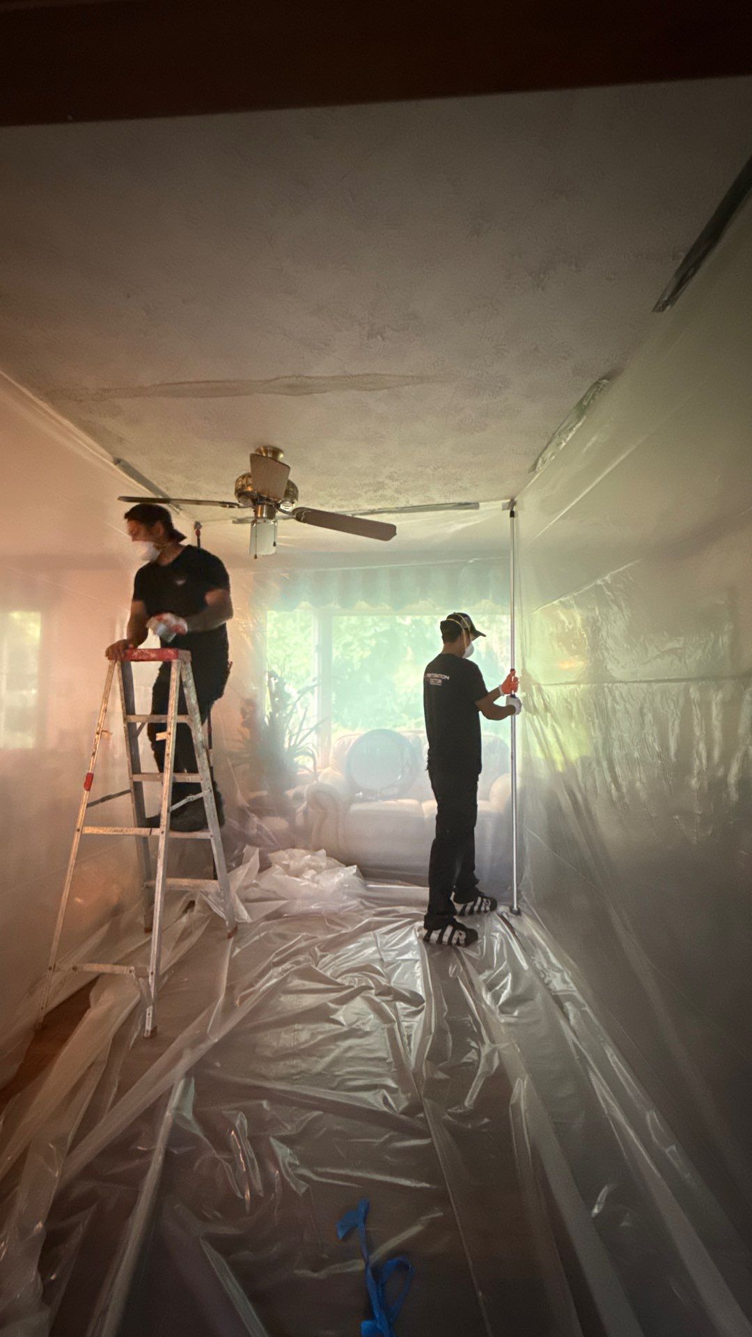 Air movers and drying apparatus operating within sealed containment during structural drying phase.