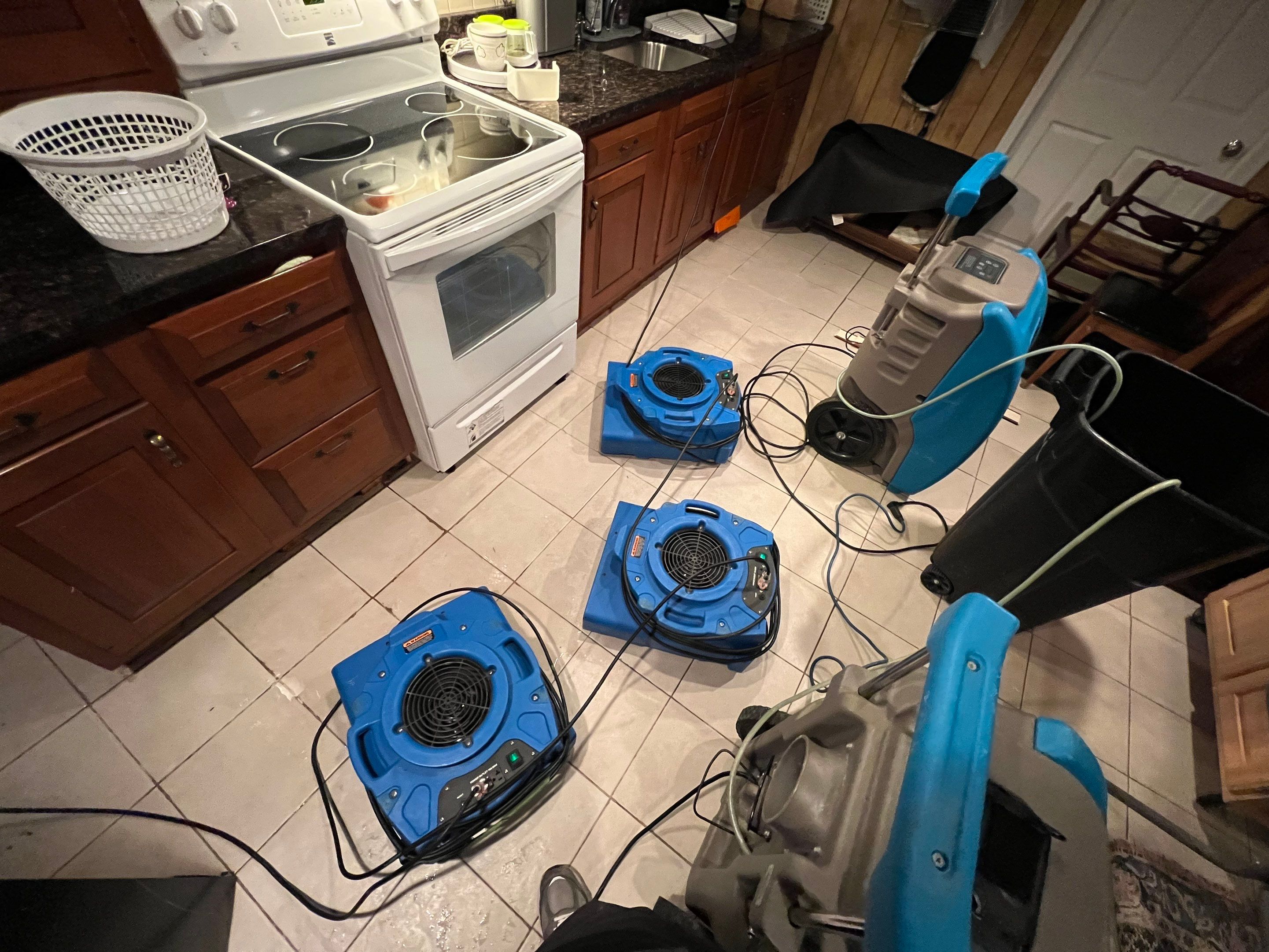 Thermal imaging camera documenting moisture distribution during water damage restoration in Annandale.