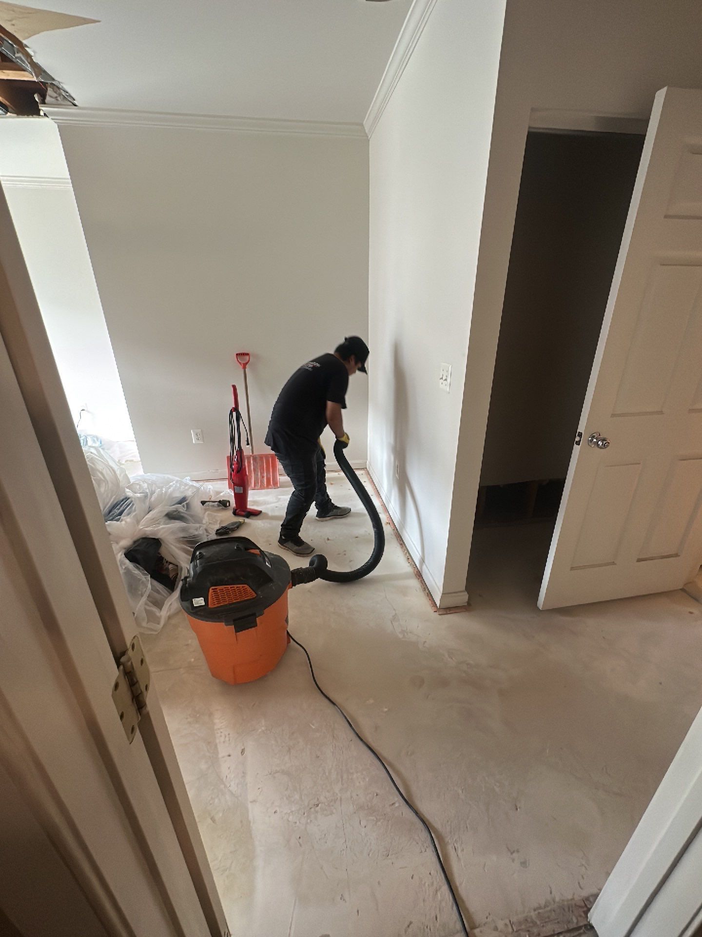 Structural drying phase with dehumidifiers and air movers positioned to manage moisture in affected areas.