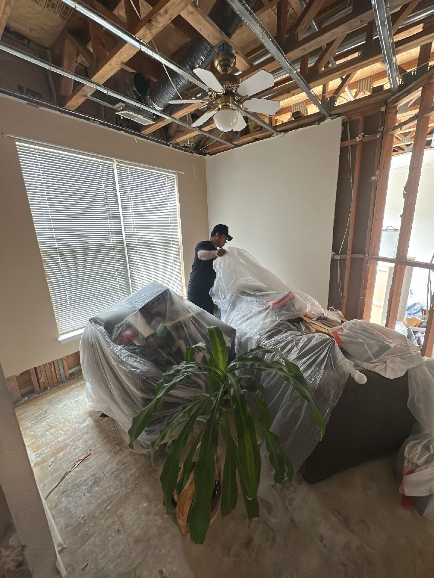 Continued drying operations with equipment monitoring moisture levels in structural cavities and wall systems.