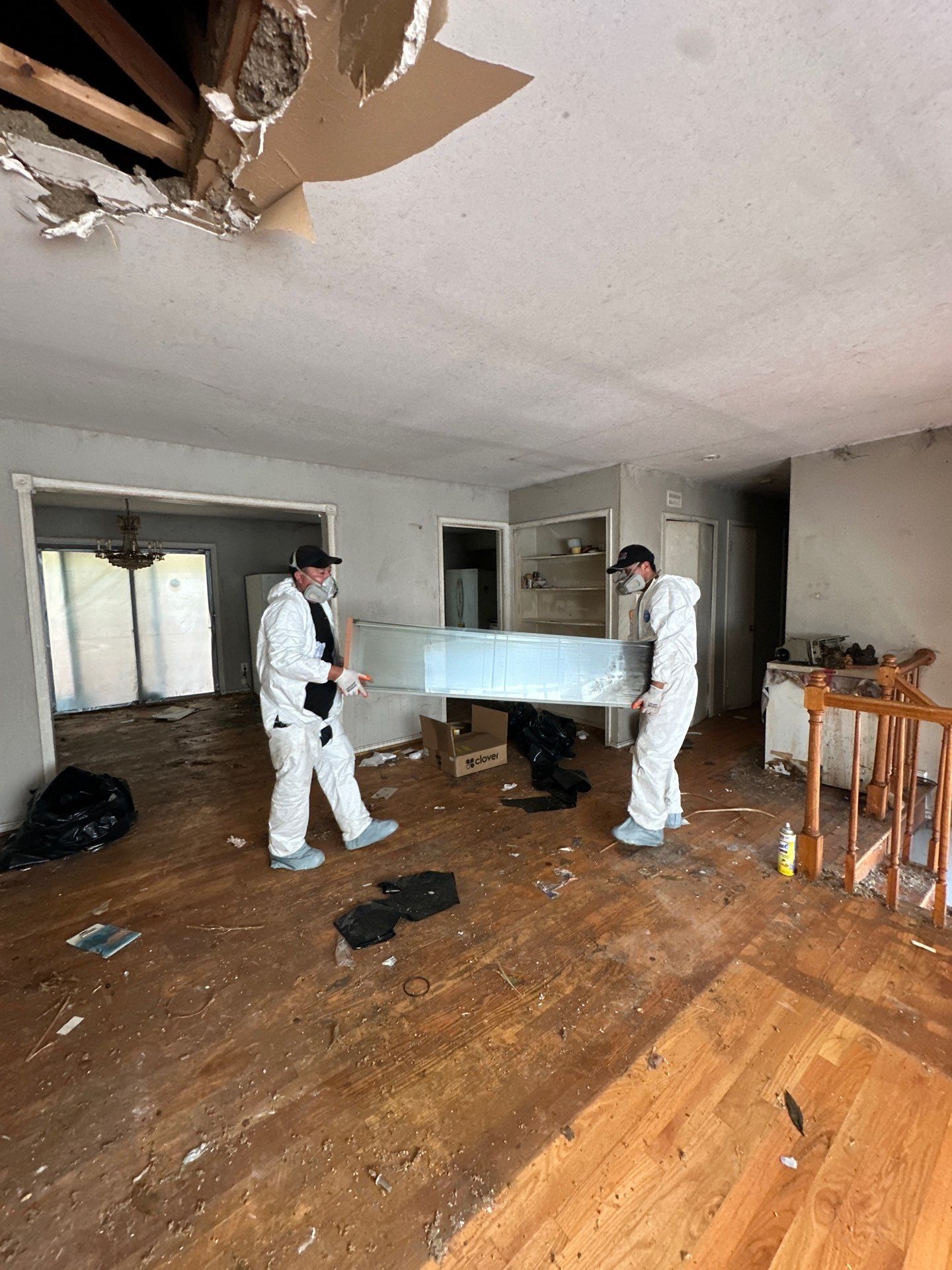 Flooring removal and substrate preparation for reinstallation following water damage remediation.