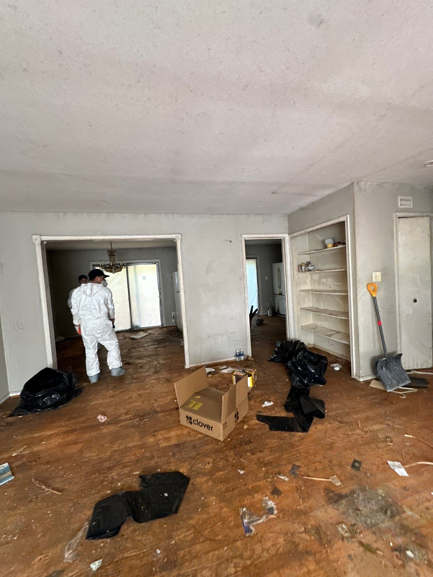 Ceiling repairs underway with drywall replacement and continued structural drying in progress.