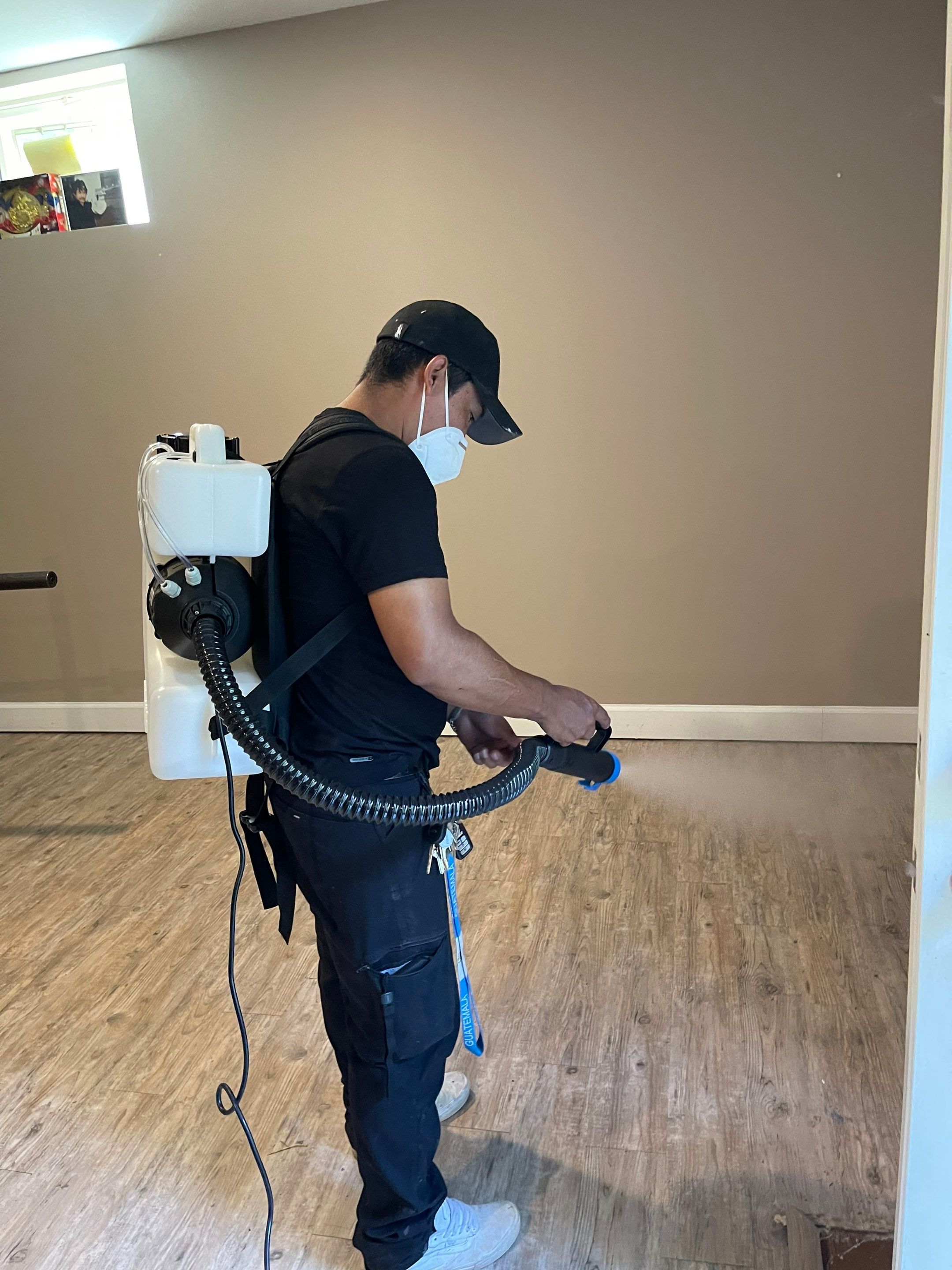 Structural drying in progress with dehumidifiers and air movers positioned throughout the affected area.