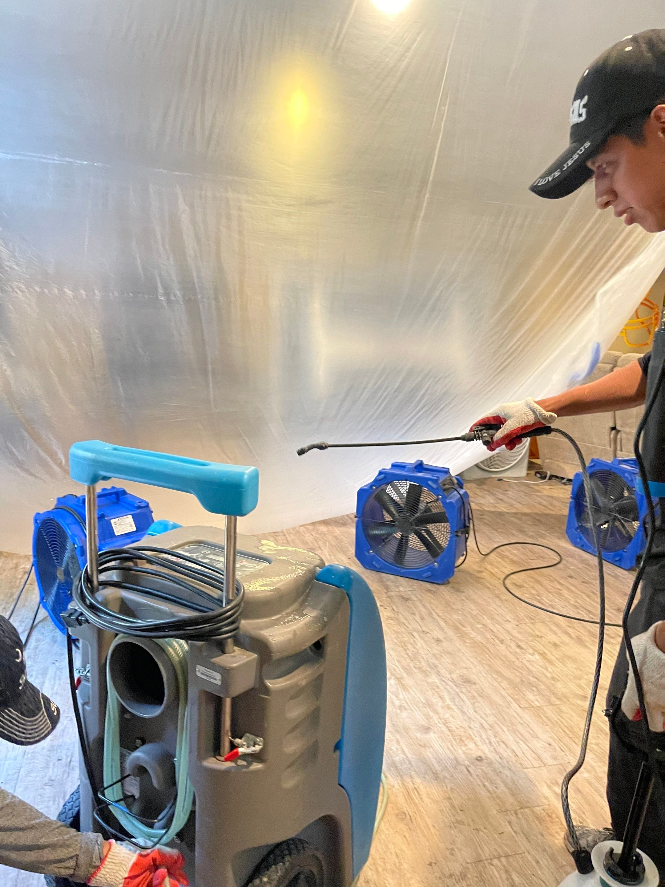 Final-stage water damage restoration showing equipment removal and structural drying completion.