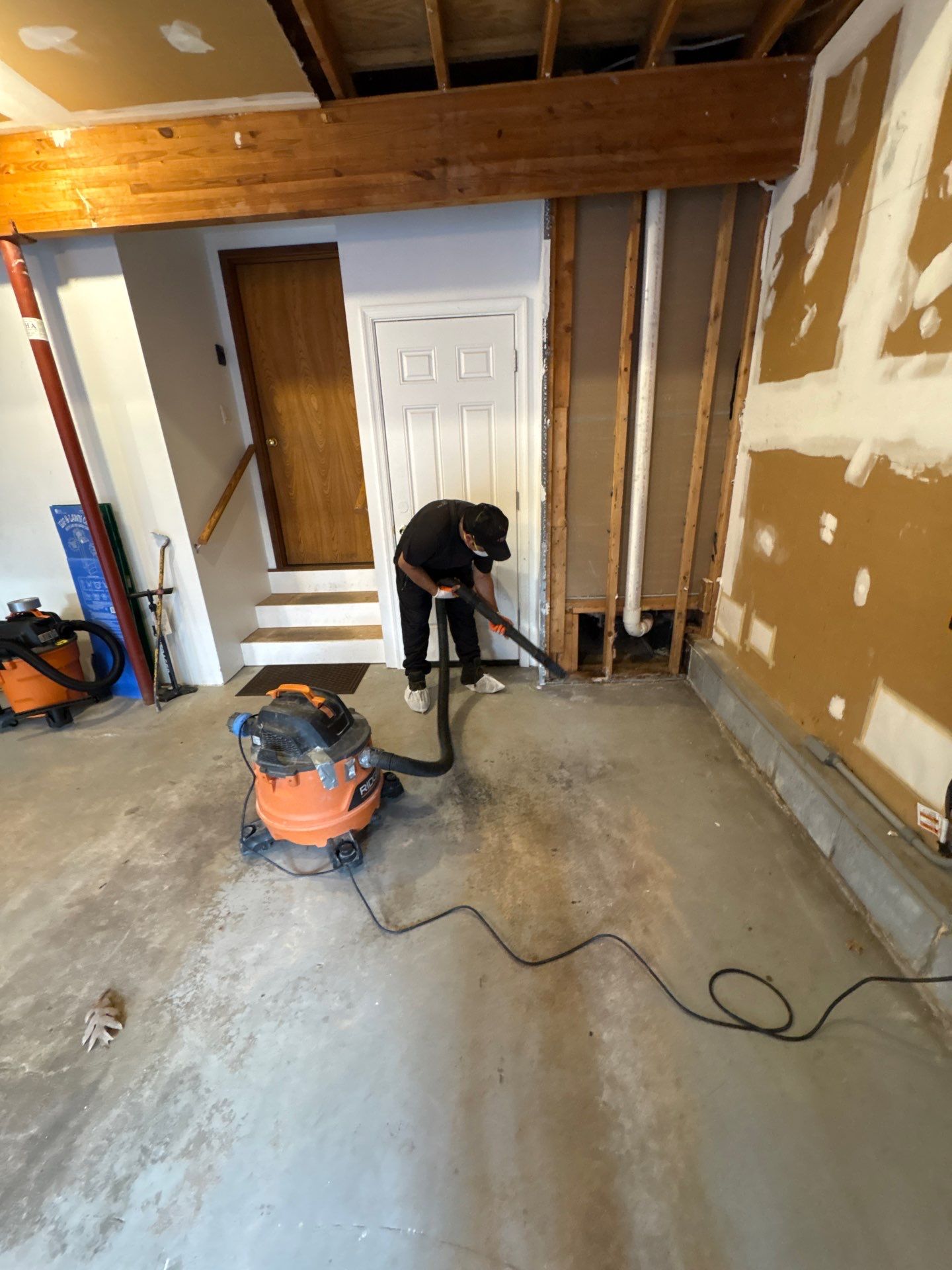 Drying equipment positioned beneath compromised ceiling during water restoration work in Reston.
