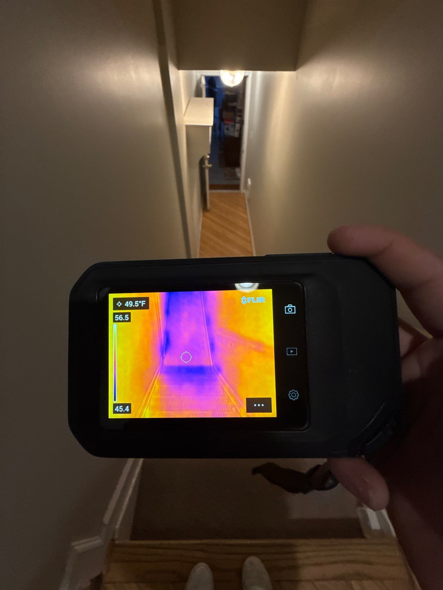 Standing water removal underway in Reston water damage restoration, wet flooring visible.