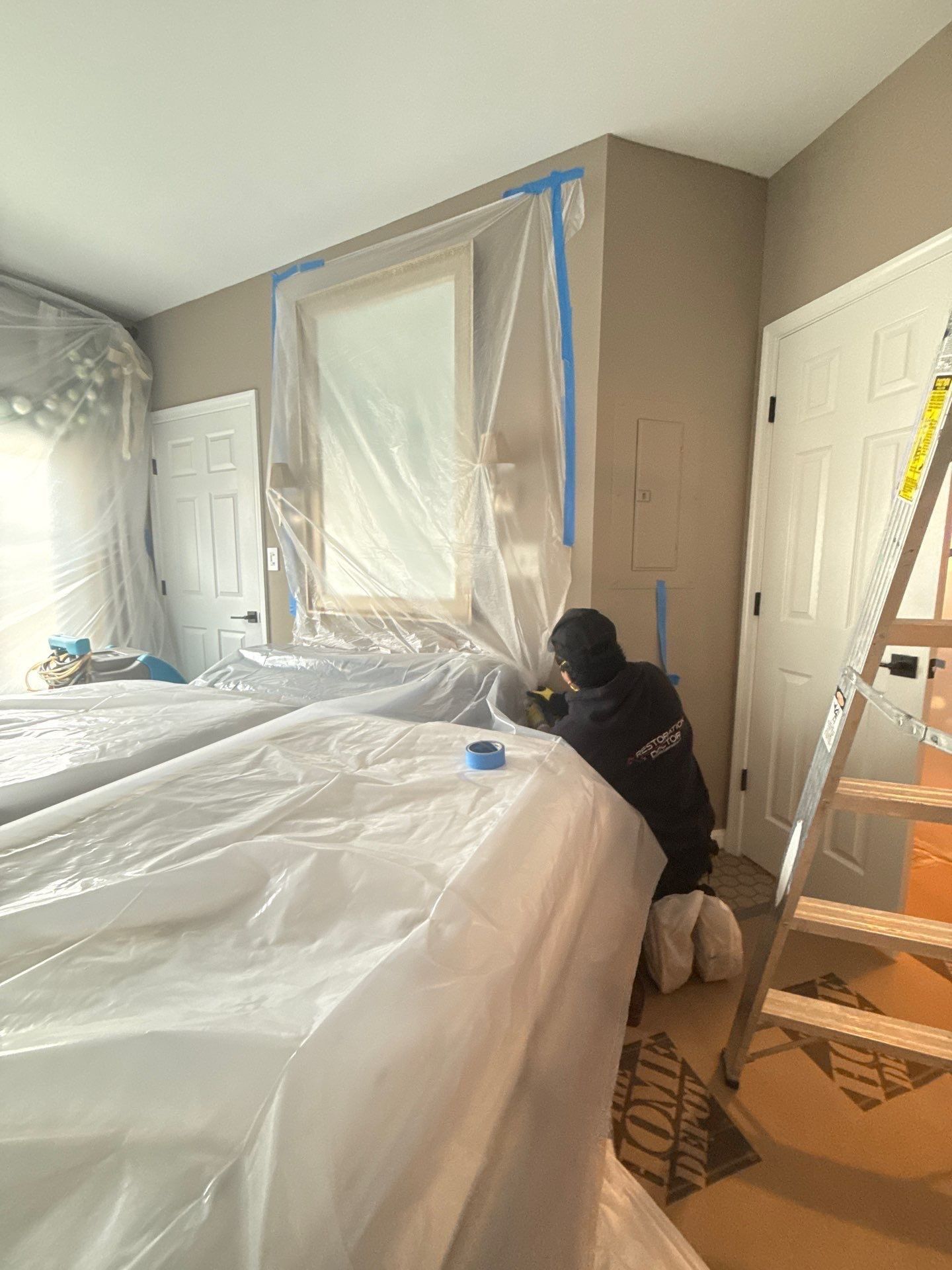 Standing water extraction underway during Alexandria water damage restoration assessment.