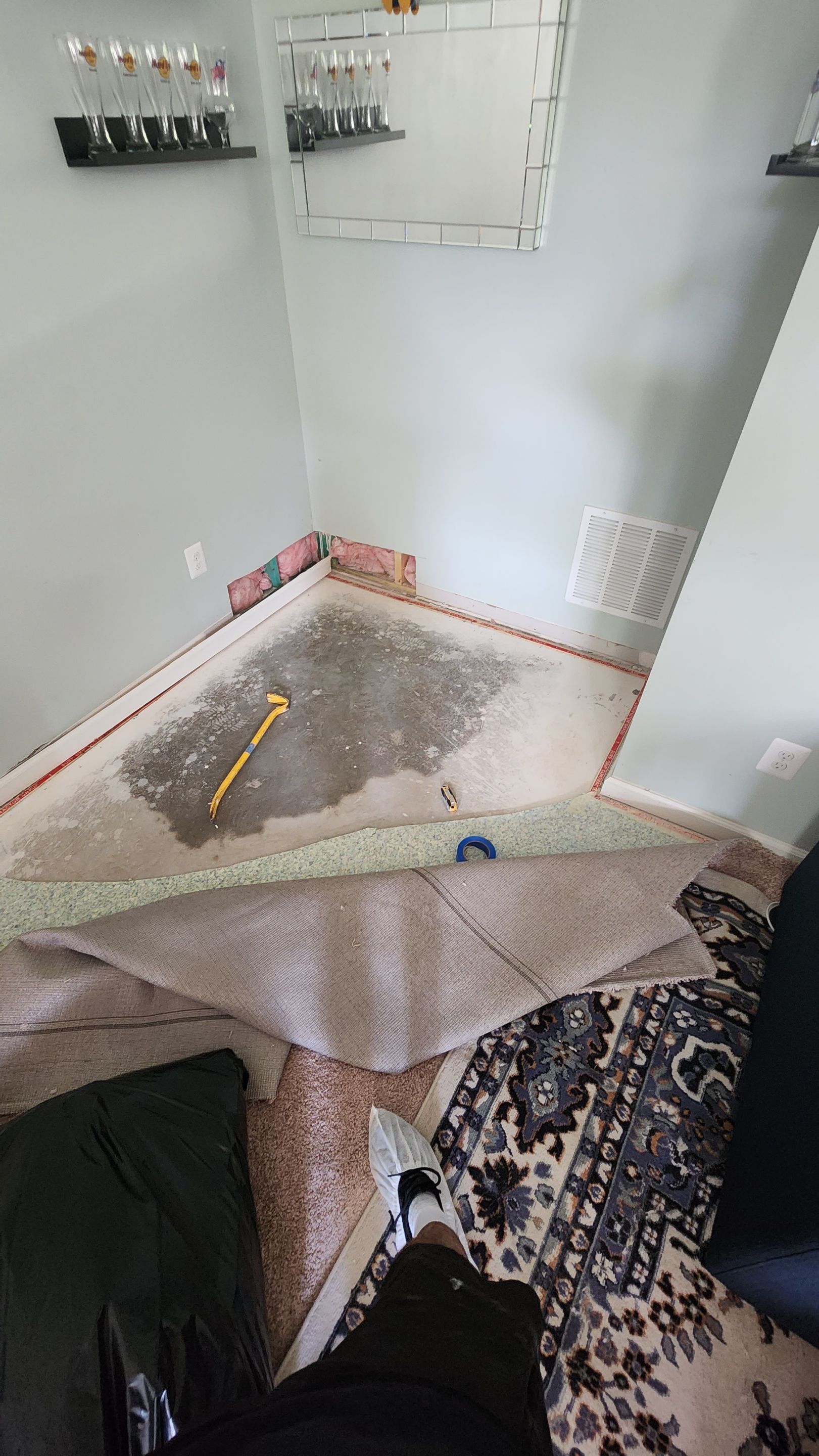 Final inspection of dried flooring after water damage restoration and carpet remediation in Ashburn.