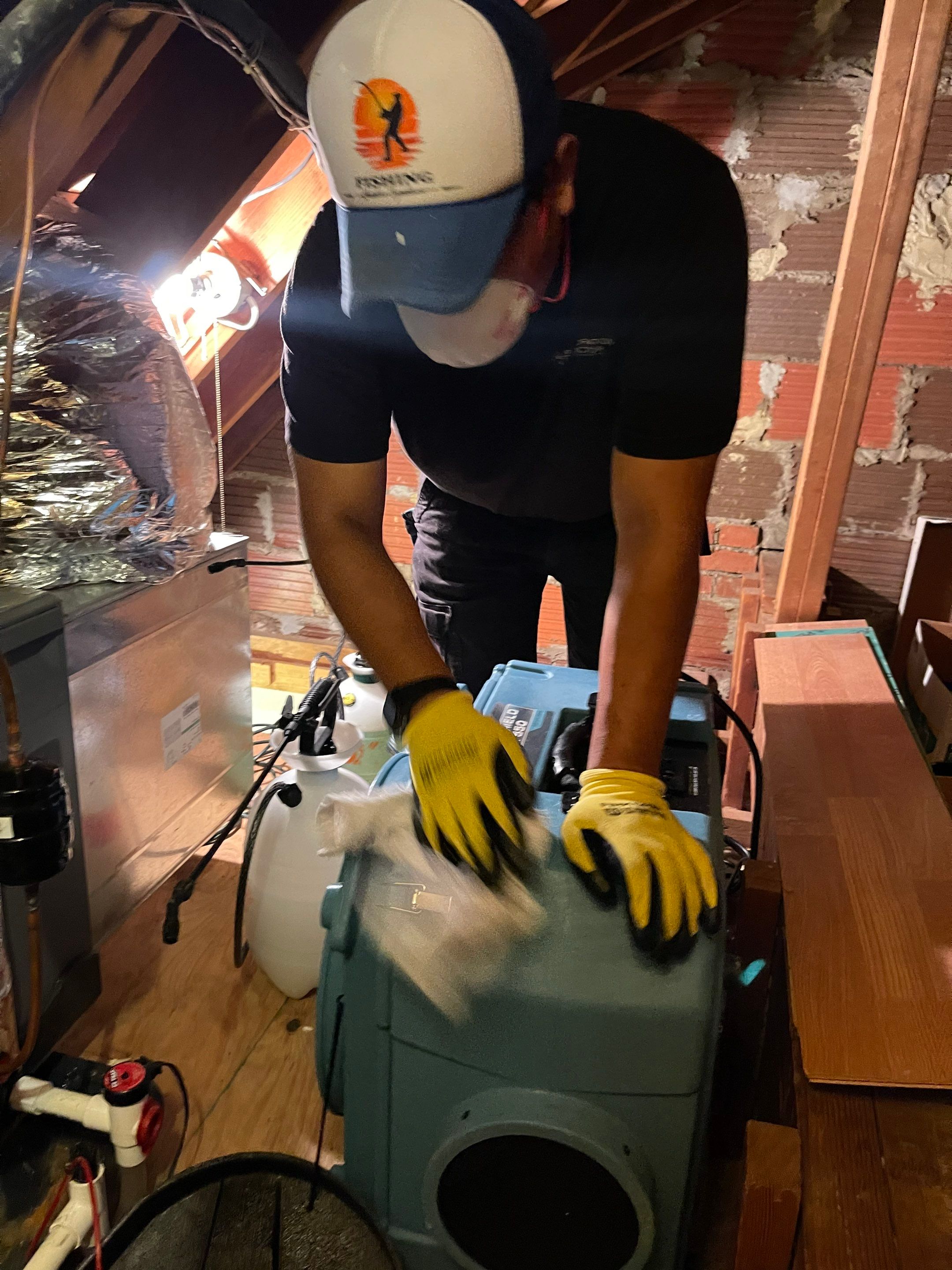 Water-damaged carpet and flooring in Arlington home with dehumidification equipment positioned for structural drying.