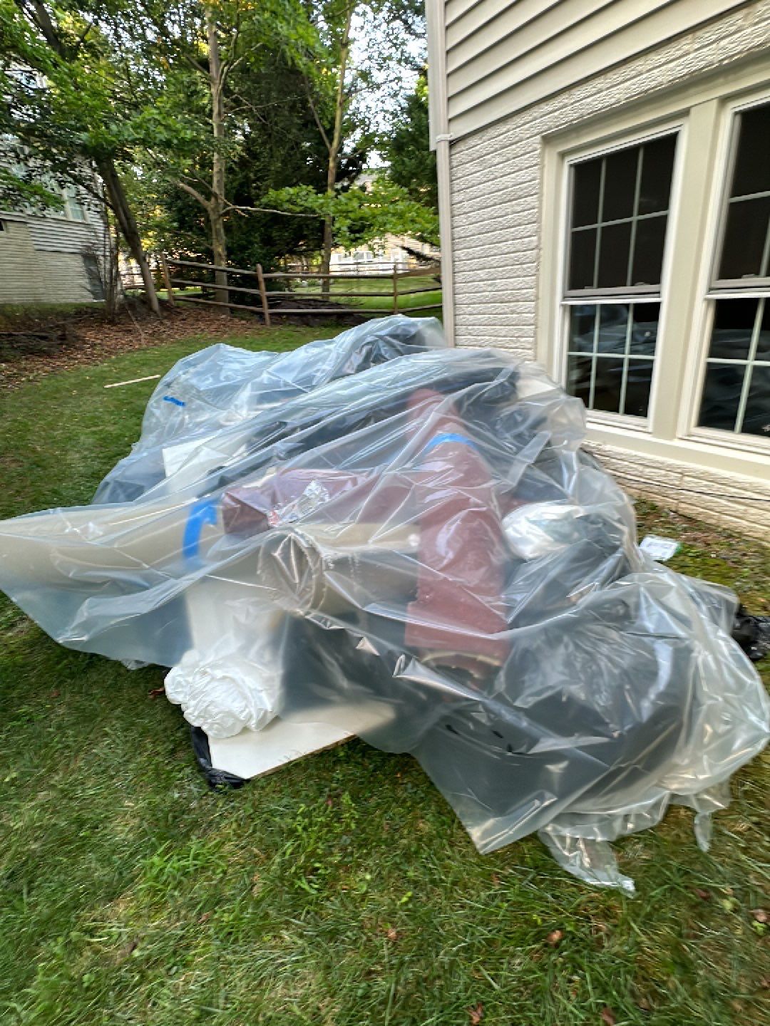 Structural drying in progress with multiple dehumidifiers and air movers positioned throughout affected rooms.