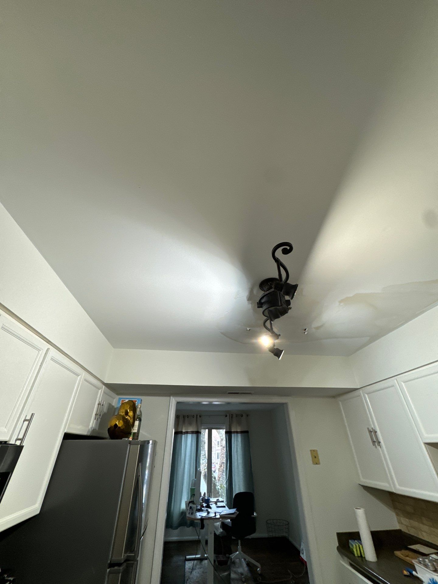 Dehumidifiers and air movers operating to dry building materials after water extraction.